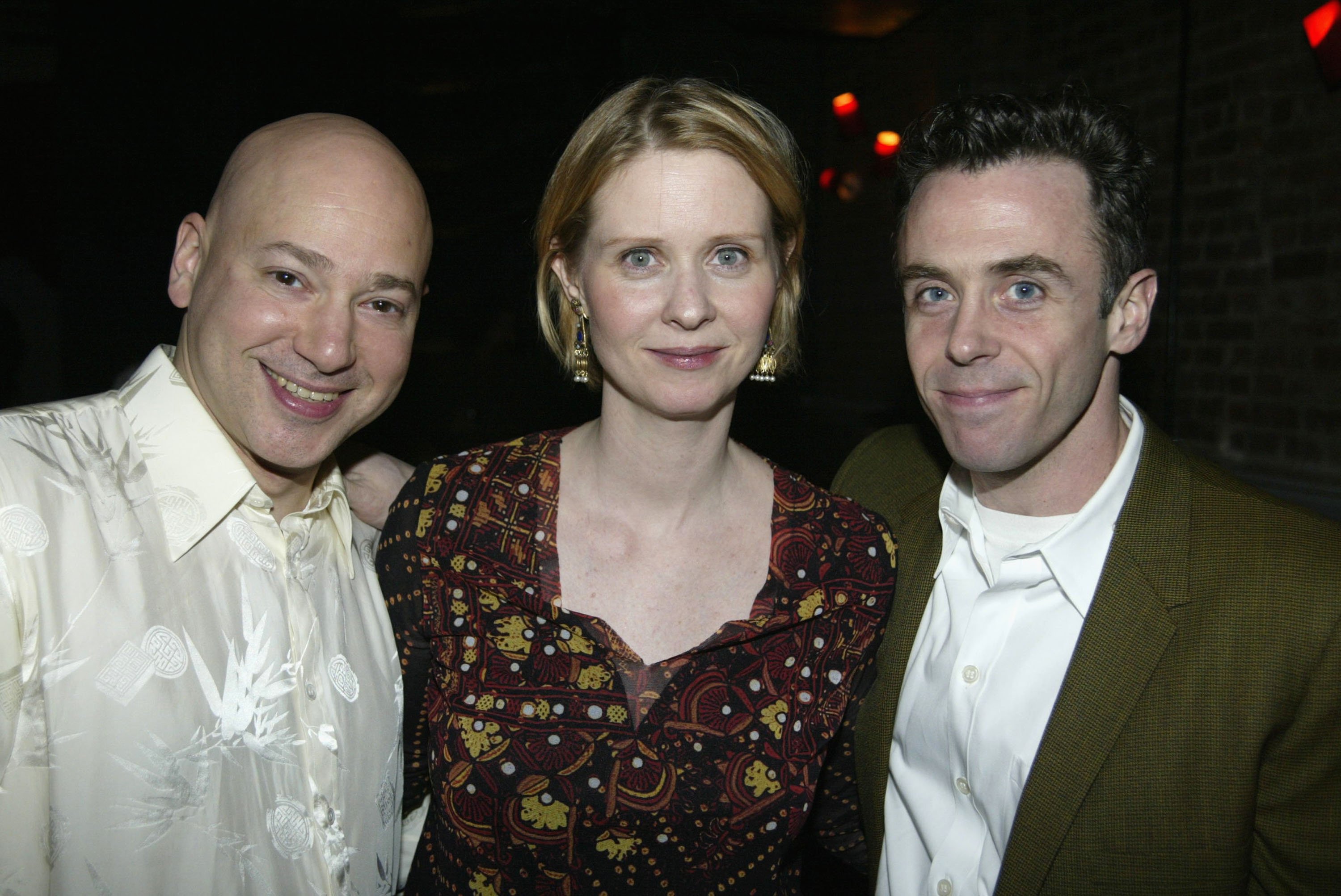 Evan Handler, Cynthia Nixon and David Eigenberg pose for a photyo together at the opening night party for 'String Fever' in New York City