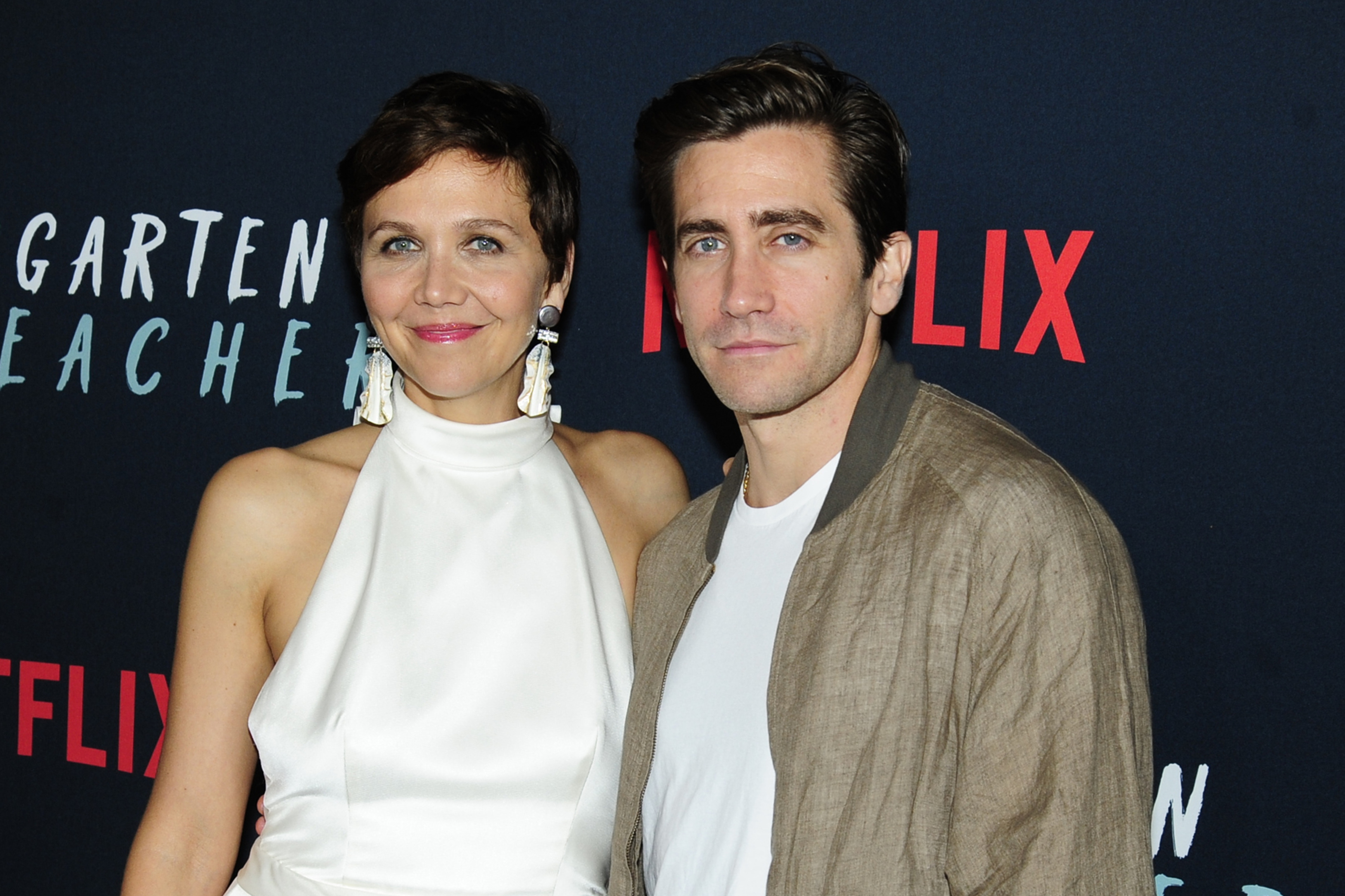 Siblings Maggie Gyllenhaal and Jake Gyllenhaal pose together on red carpet ahead of special Netflix screening