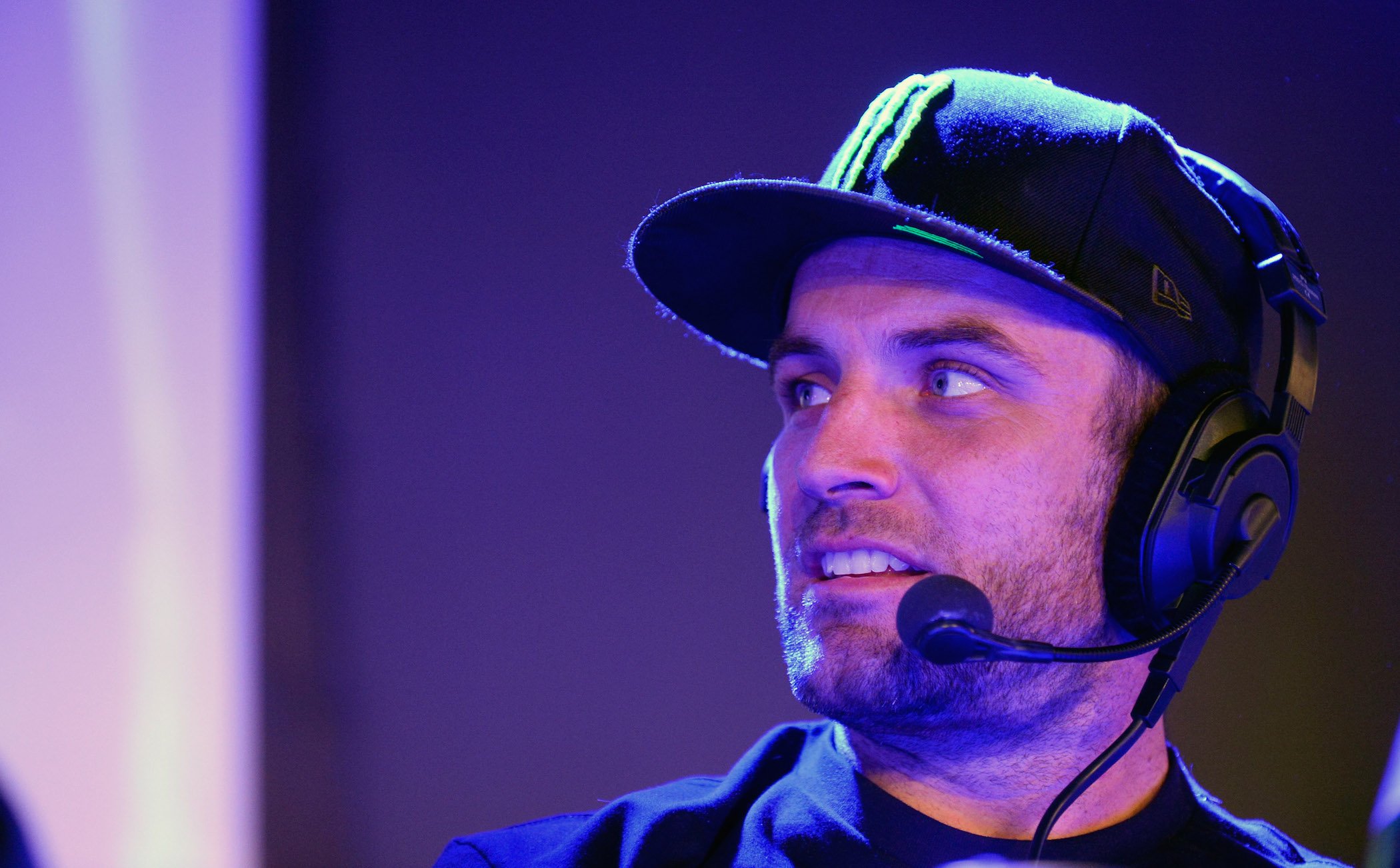 T.J. Lavin, the host of MTV's 'The Challenge,' wearing a headset and looking concerned at an event