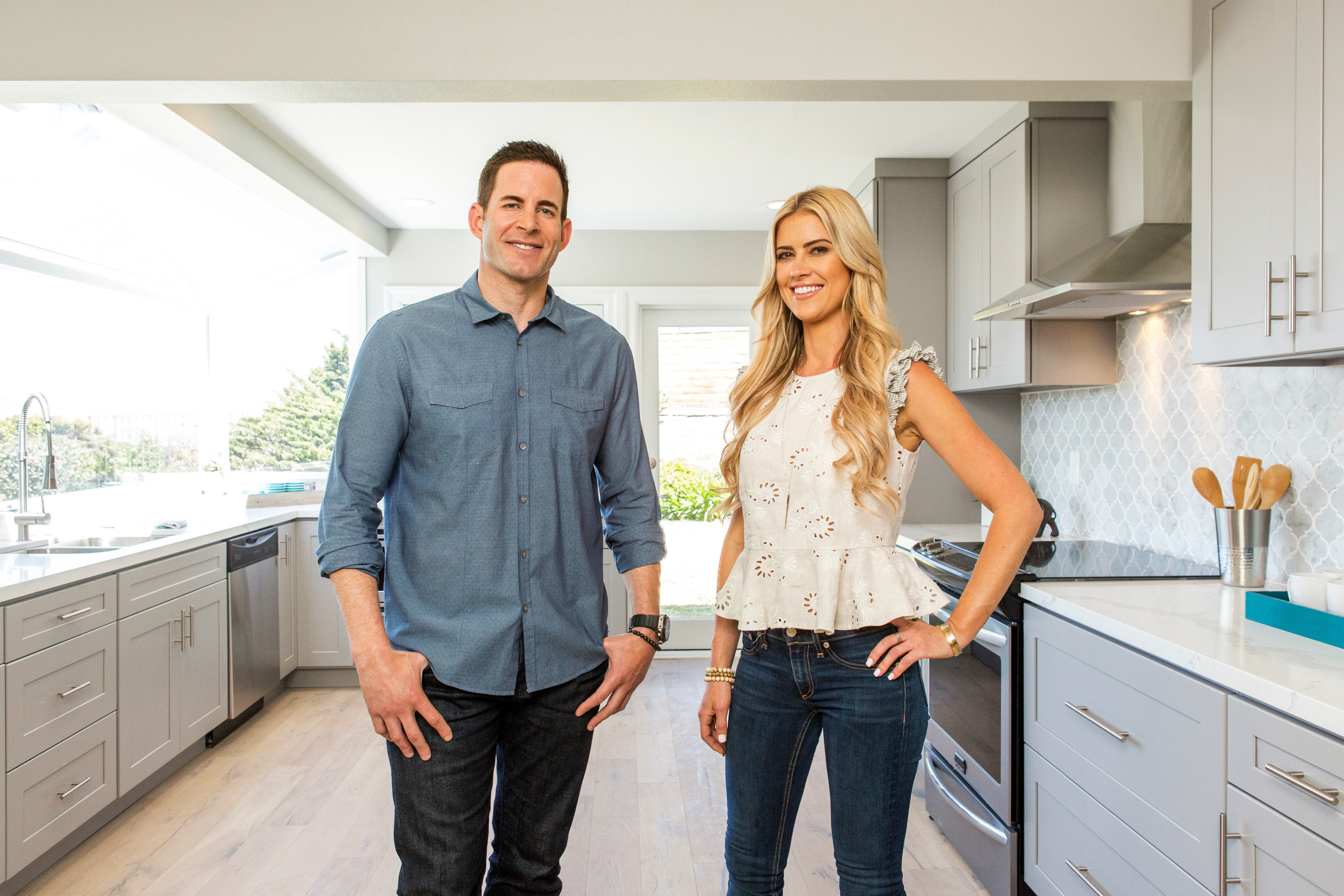 Tarek El Moussa and Christina Haack standing in a kitchen
