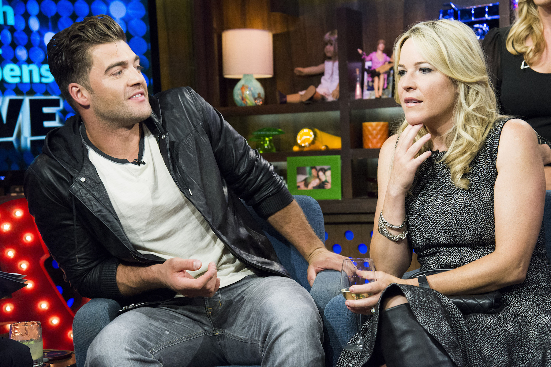 Chris 'CT' Tamburello and Beth Stolarczyk from MTV's 'The Challenge' sitting next to each other on chairs and talking while on 'Watch What Happens Live' 