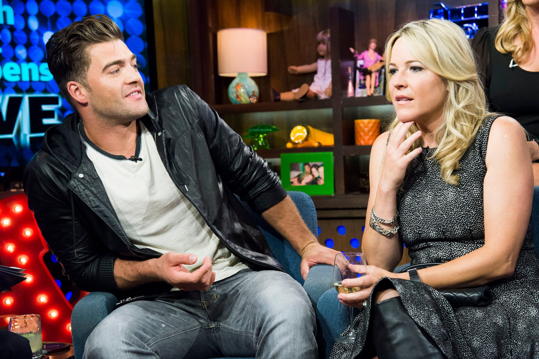 Chris 'CT' Tamburello and Beth Stolarczyk from MTV's 'The Challenge' sitting next to each other on chairs and talking while on 'Watch What Happens Live'