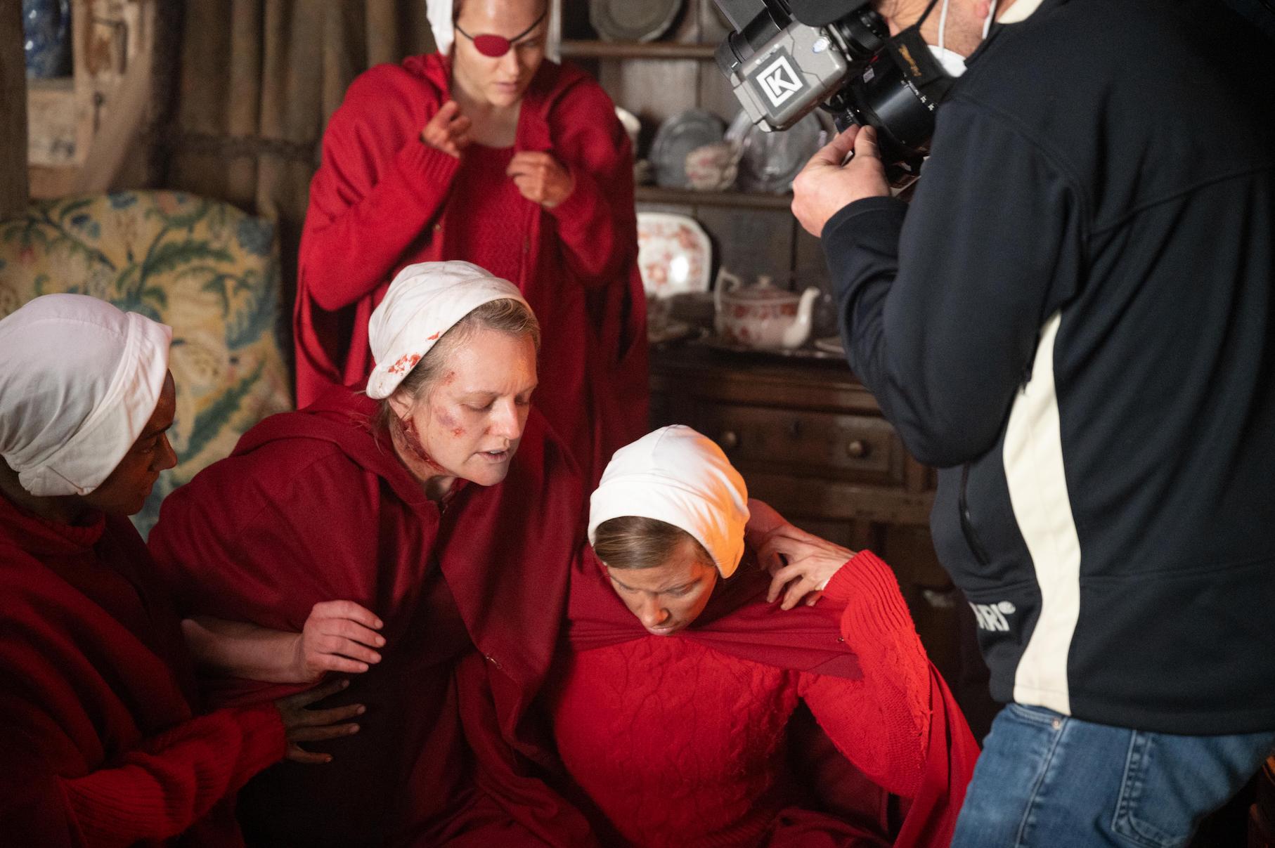 June Osborne surrounded by other handmaids and the camera crew for 'The Handmaid's Tale' Season 4