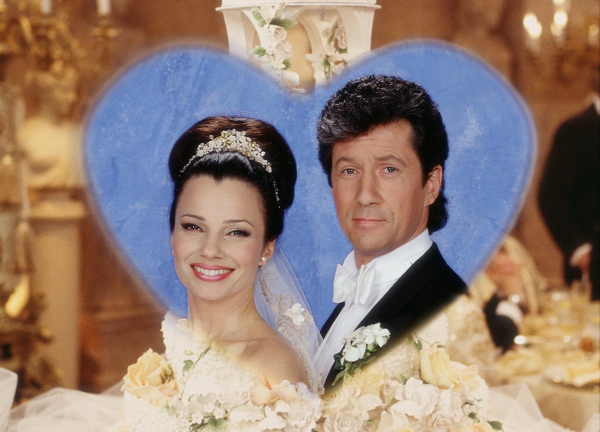 Fran Drescher and Charles Shaugnessy vignetted in a photo of the wedding cake from THE NANNY episode where their characters were married.