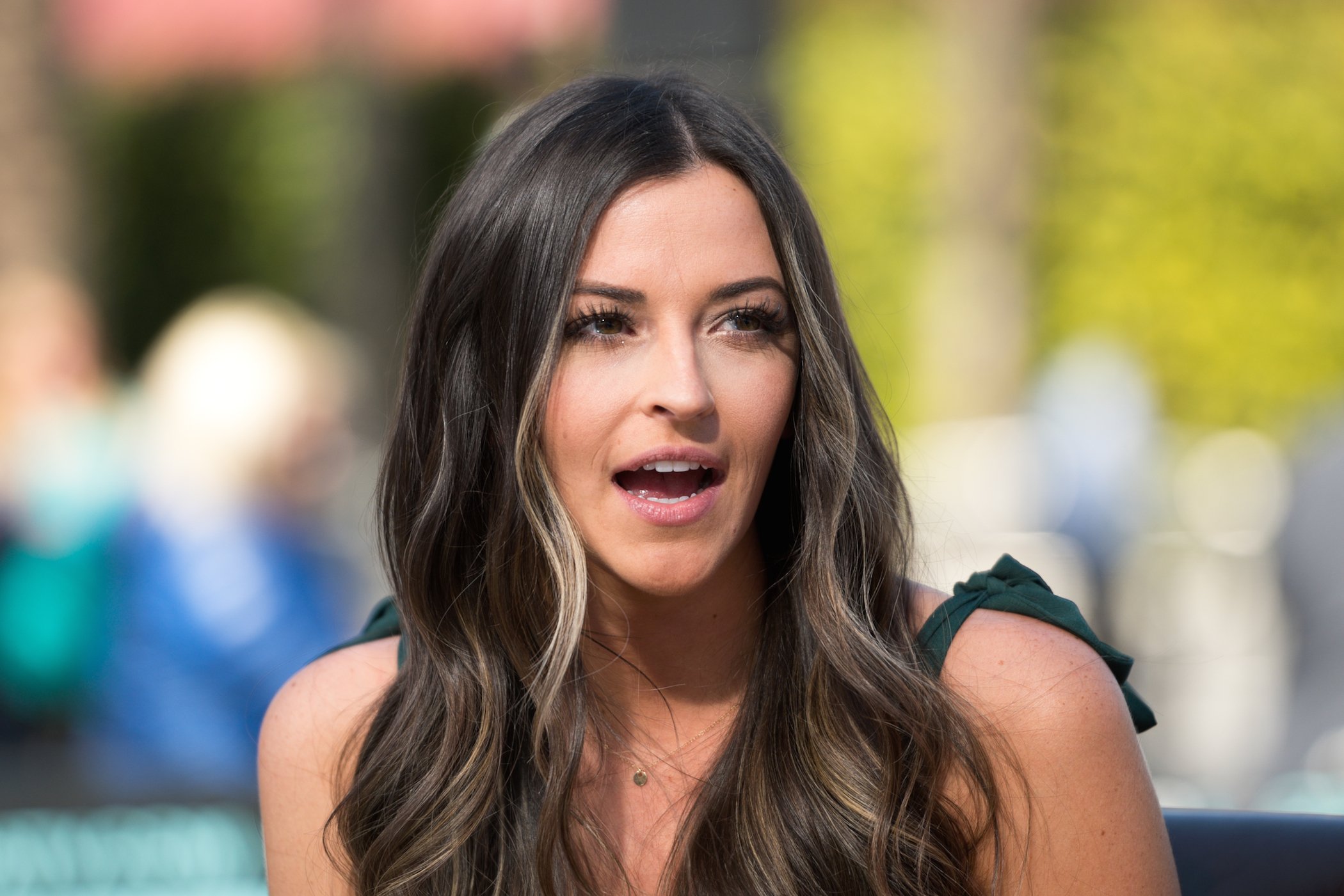 Tia Booth, Colton Underwood's ex from 'Bachelor in Paradise,' sitting and talking