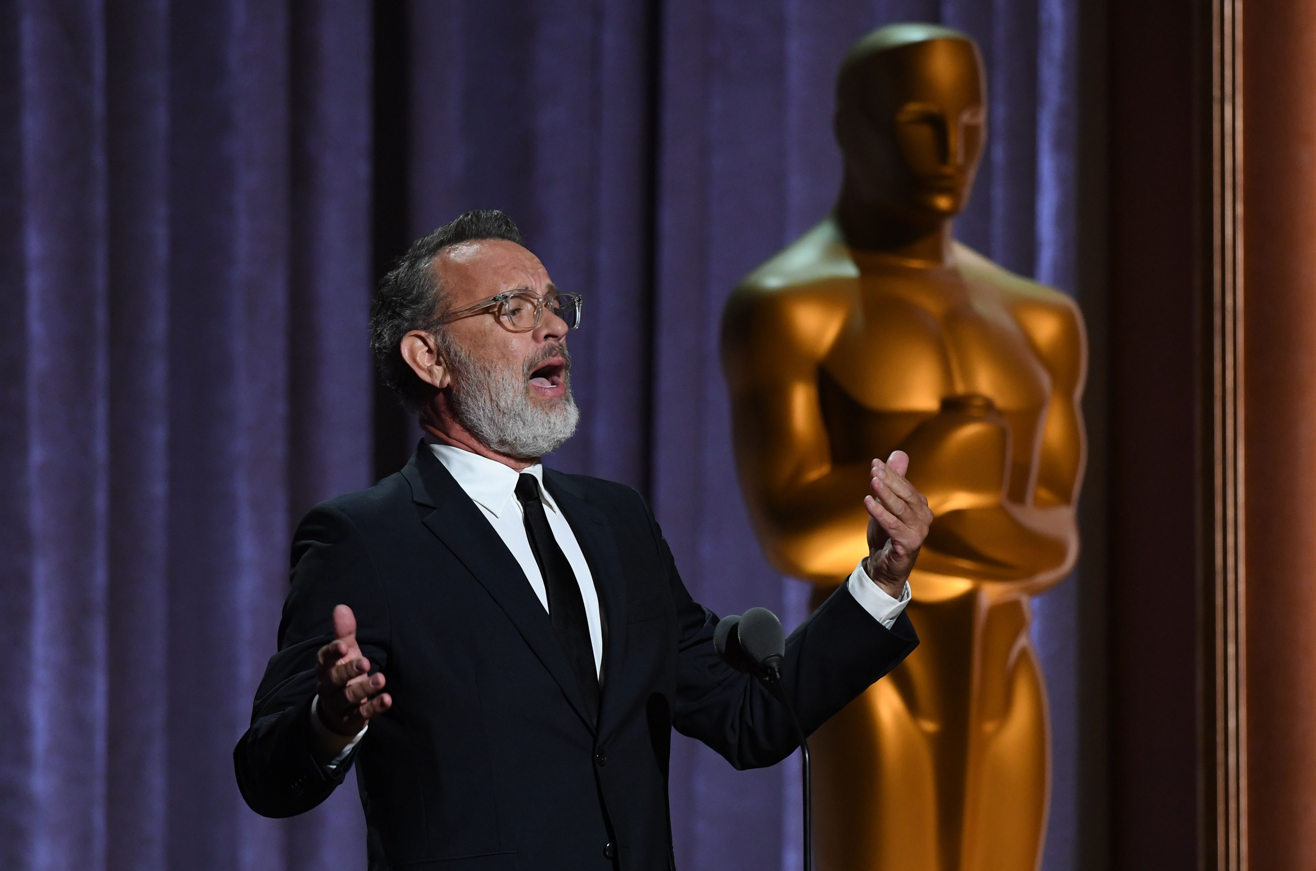 Tom Hanks standing at the Oscars Governors Awards