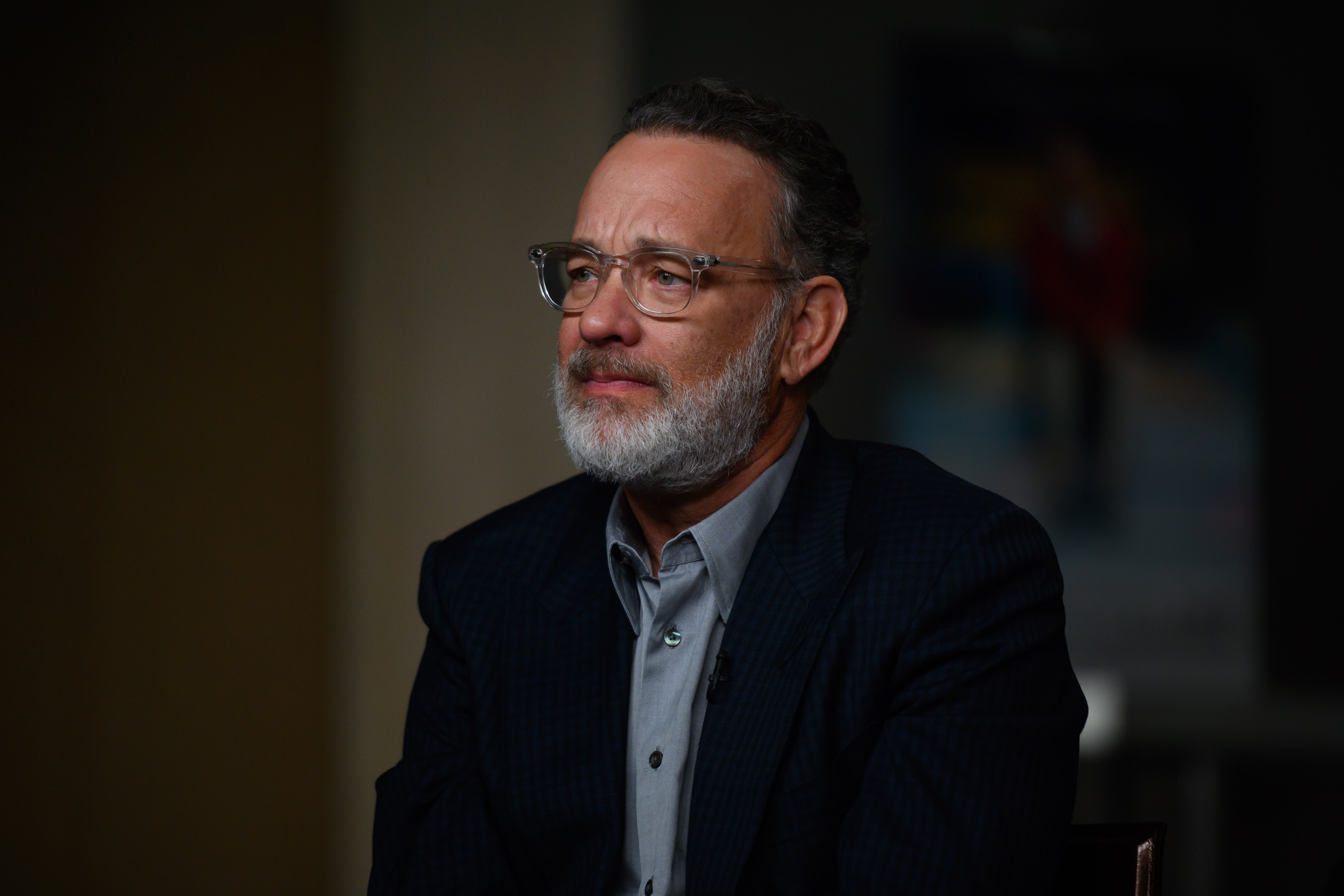 Tom Hanks with a beard and glasses