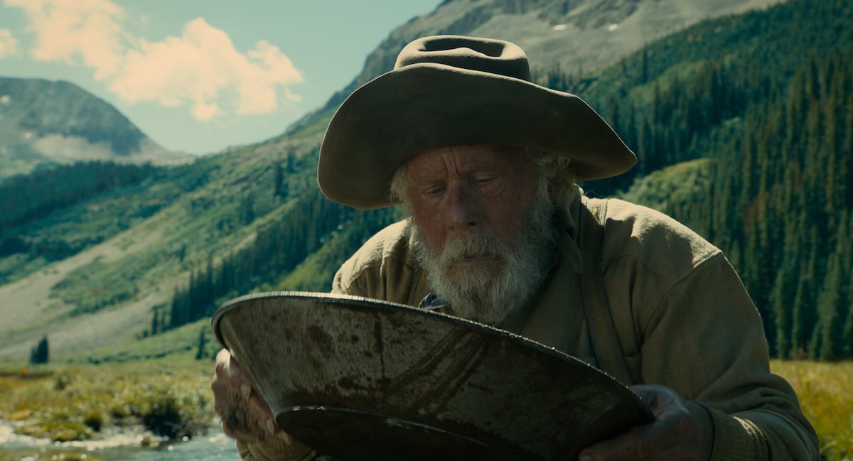 Tom Waits panning for gold in The Ballad of Buster Scruggs