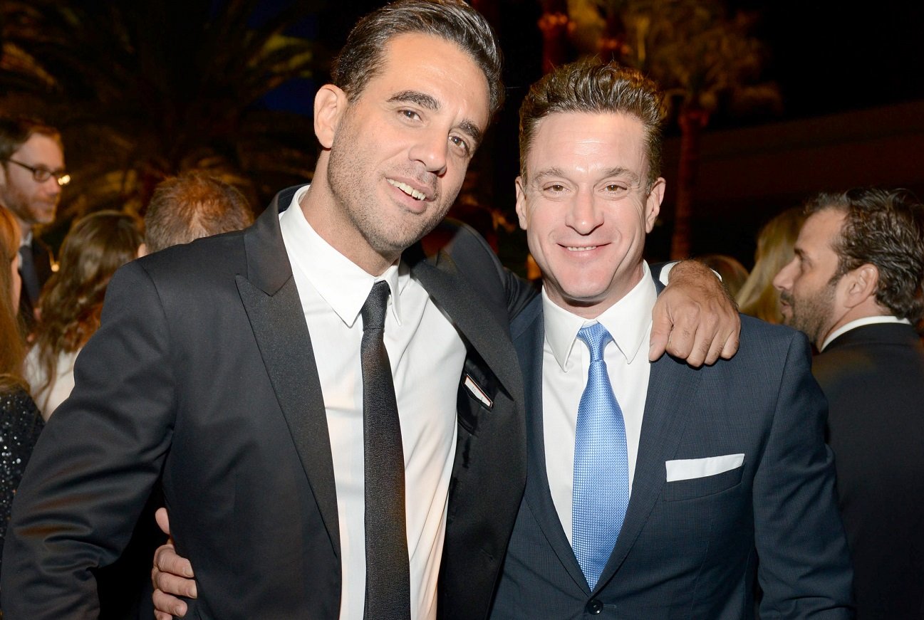 Bobby Cannavale and Chris Caldovino smile and pose in 2013