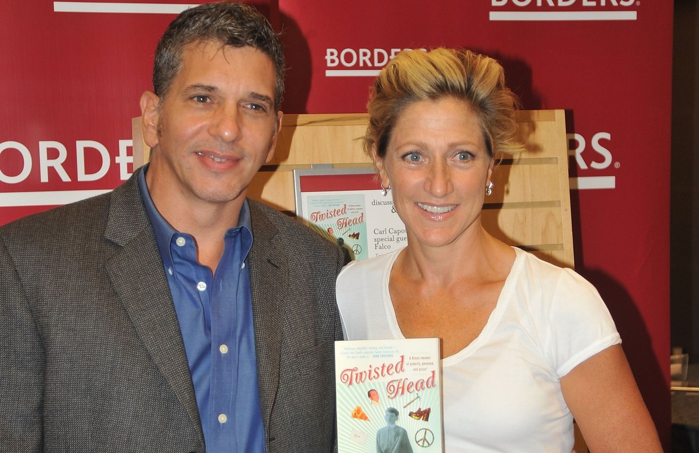 Carl Capotorto and Edie Falco smile for the camera at a book event in 2009