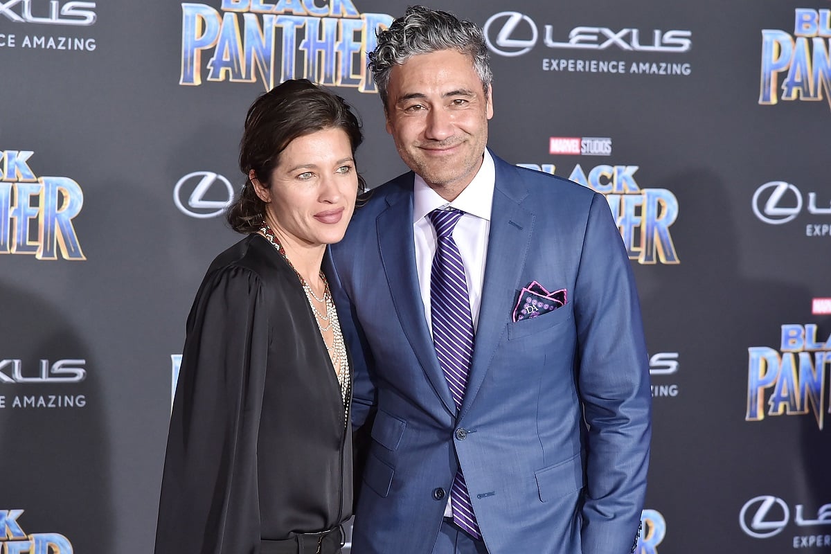 Taika Waititi (R) and Chelsea Winstanley attend the premiere of Disney and Marvel's 'Black Panther' on January 29, 2018, in Hollywood, California.