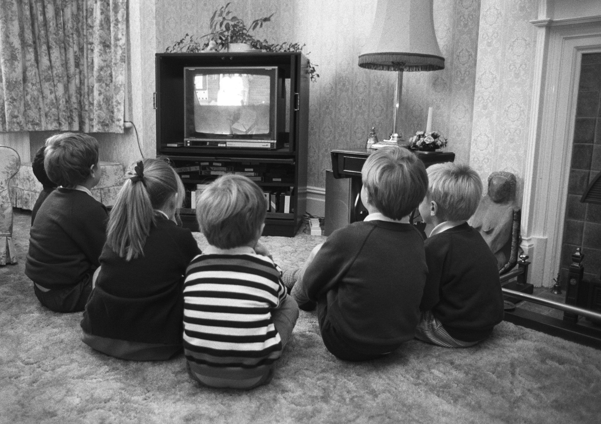 A group of young British children watching television in October 1988