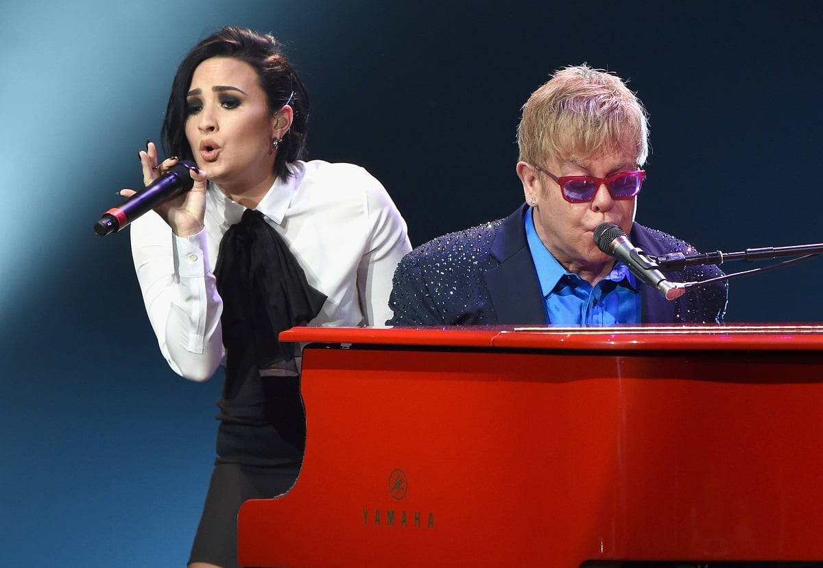 Elton John (R) performing with Demi Lovato on January 13, 2016, at the Wiltern in Los Angeles.