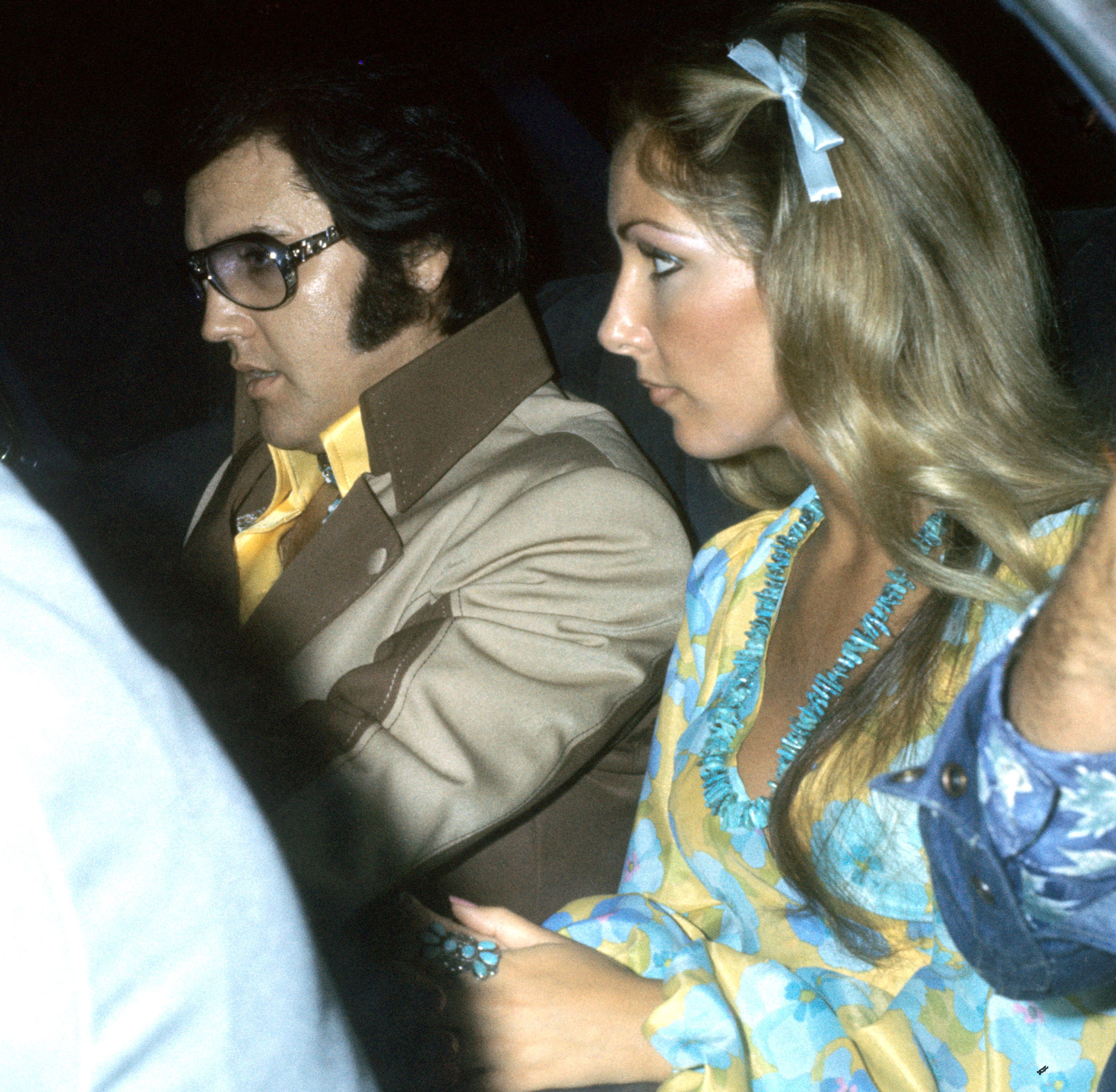 Elvis Presley and Linda Thompson in a car
