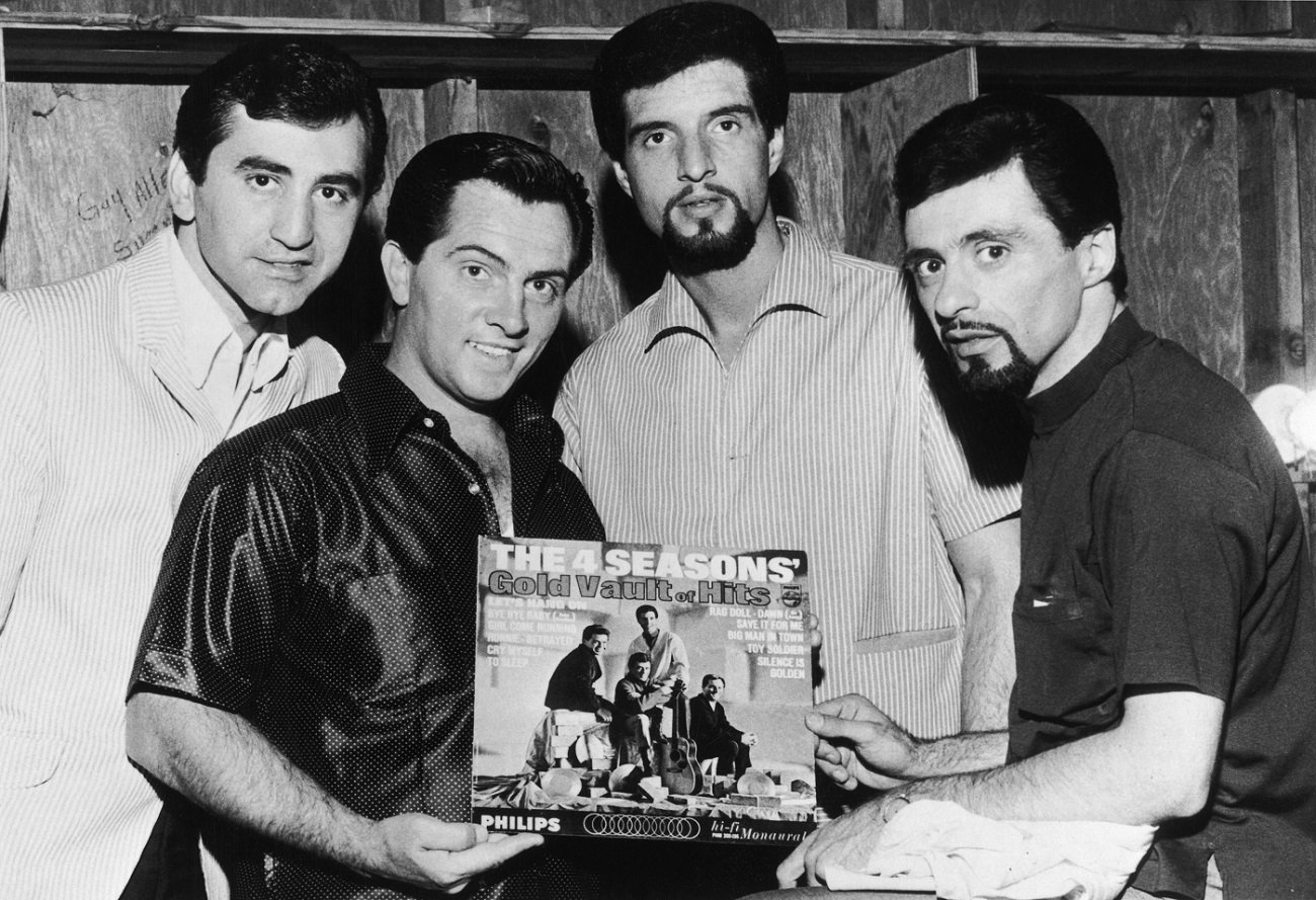 The Four Seasons pose with 1 of their albums in 1966