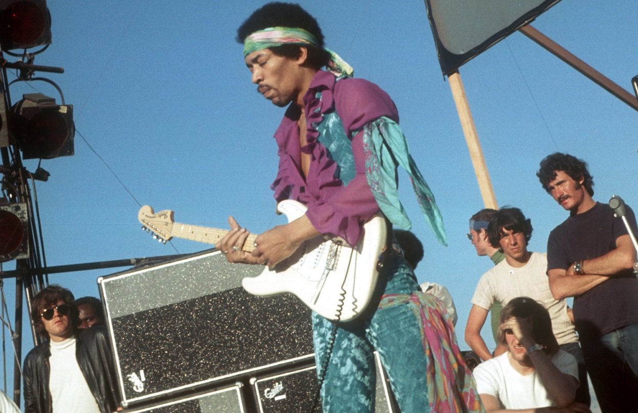 Jimi Hendrix performing at an outdoor festival in 1969