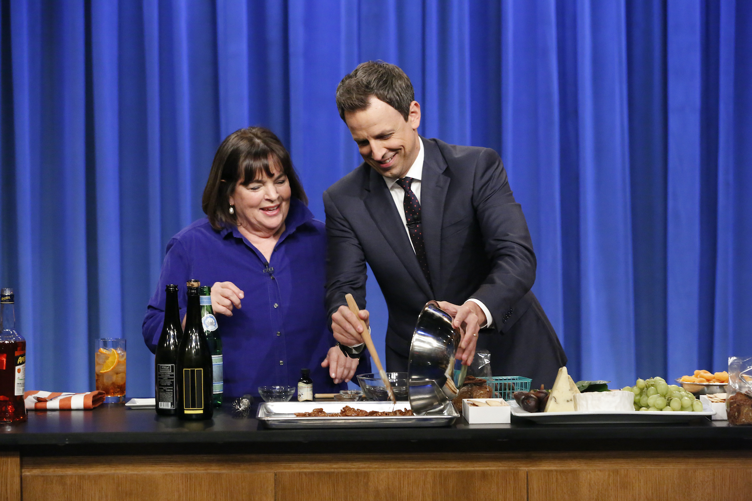 Ina Garten cooks with Seth Meyers during a cooking segment on Late Night With Seth Meyers