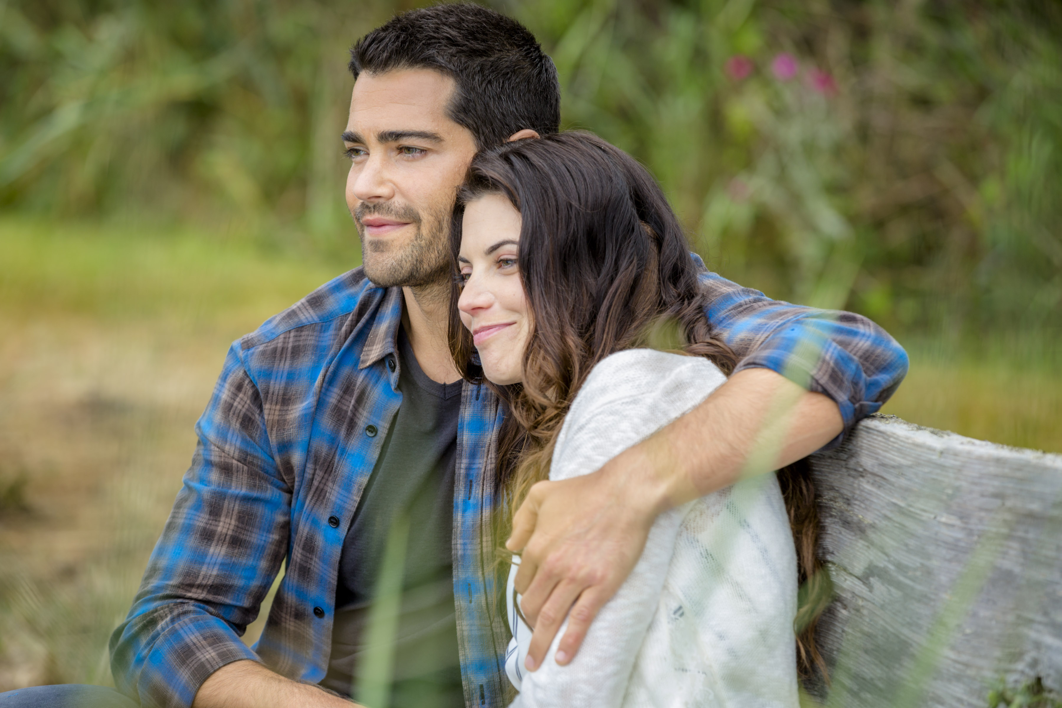 Jesse Metcalfe with his arm around Meghan Ory in Chesapeake Shores