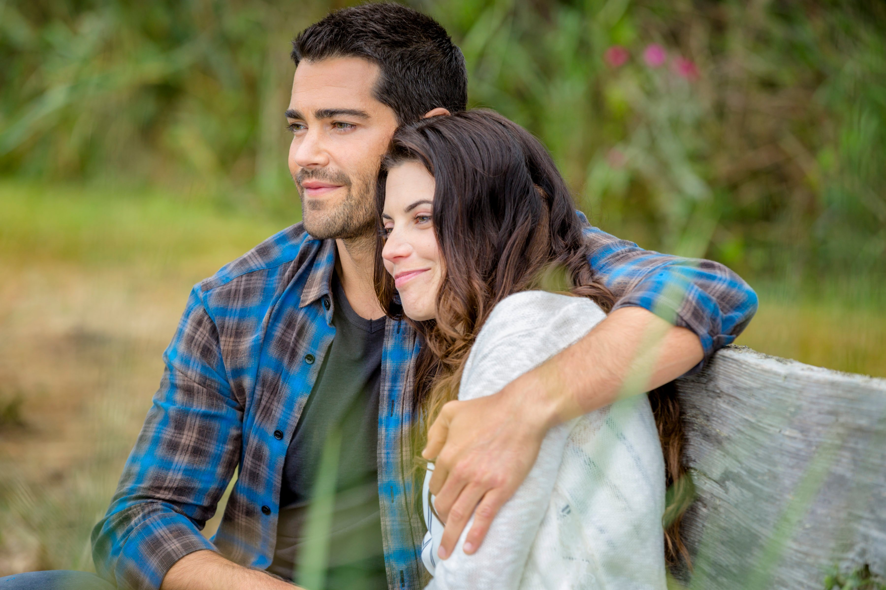 Jesse Metcalfe with his arm around Meghan Ory in Chesapeake Shores
