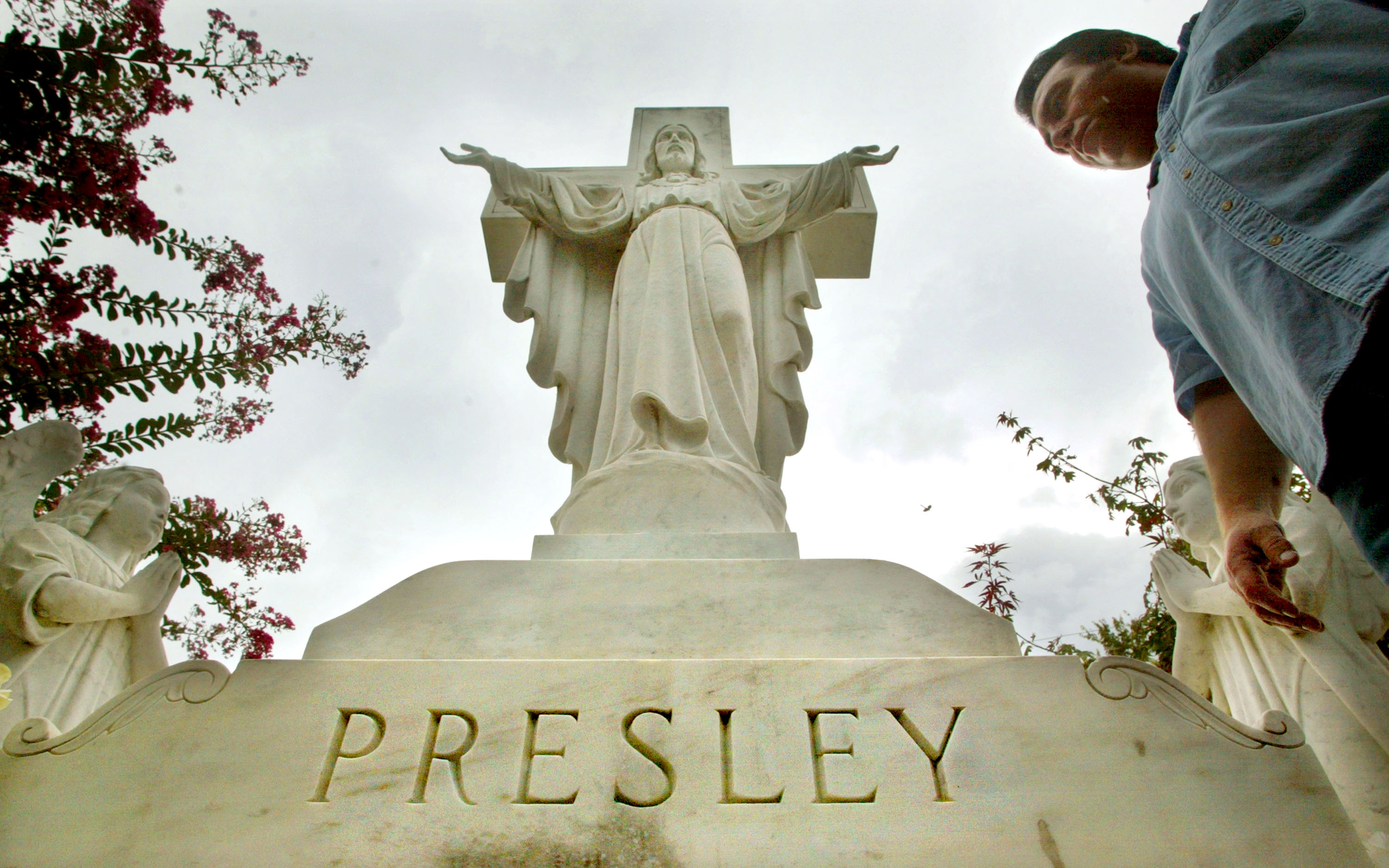 A Jesus statue atop the Presley family headstone