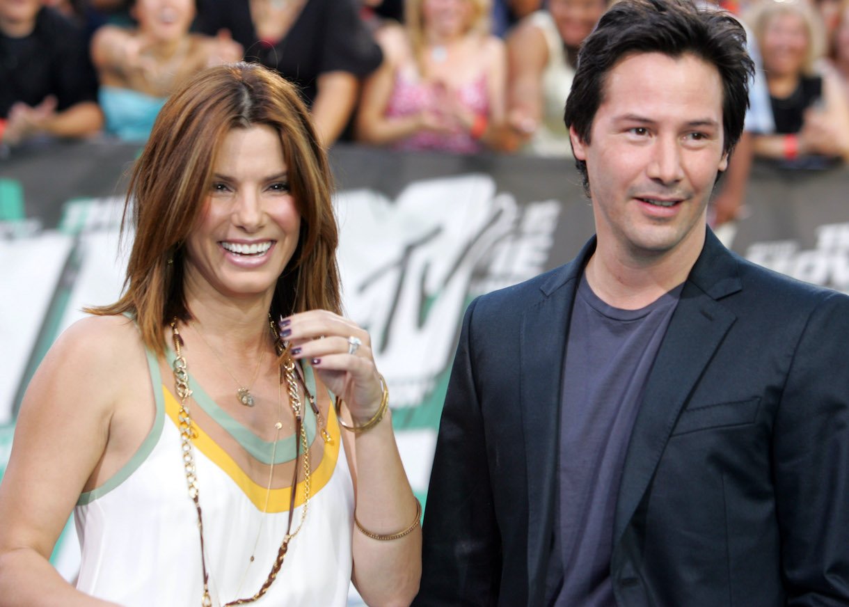 Sandra Bullock and Keanu Reeves smile during 2006 MTV Movie Awards red carpet