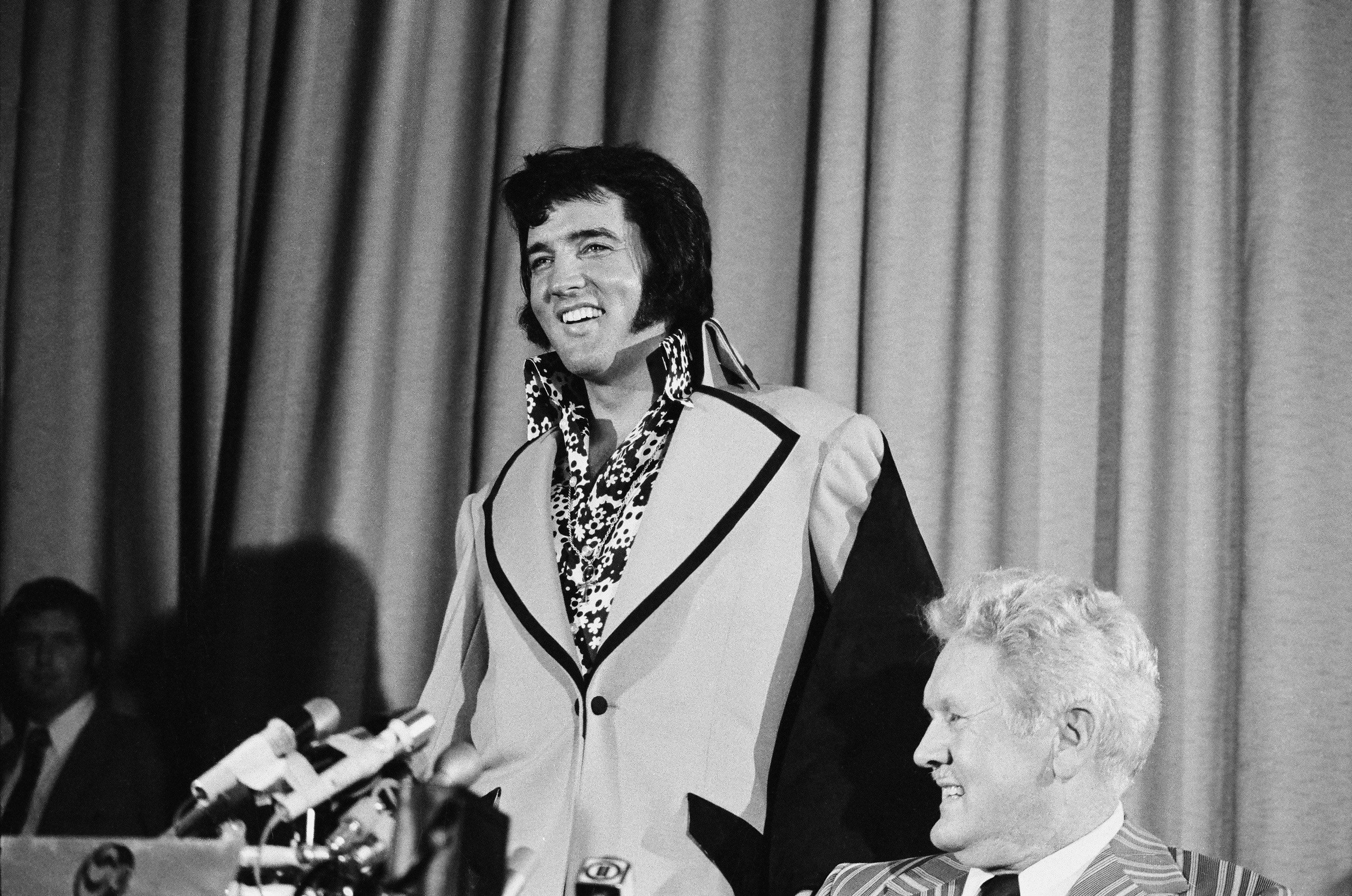 Elvis Presley wearing a high collar