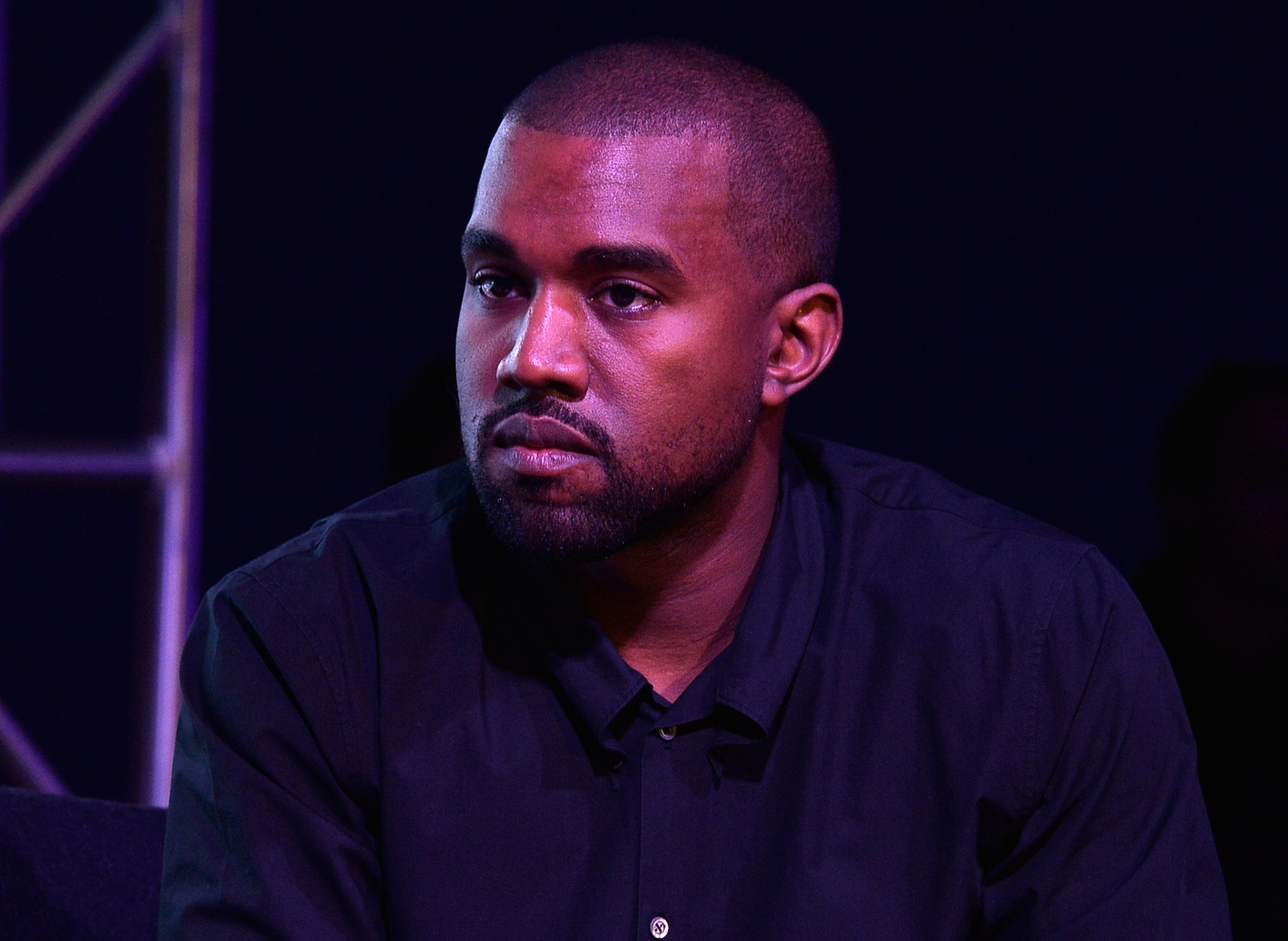 Kanye West wearing a black shirt