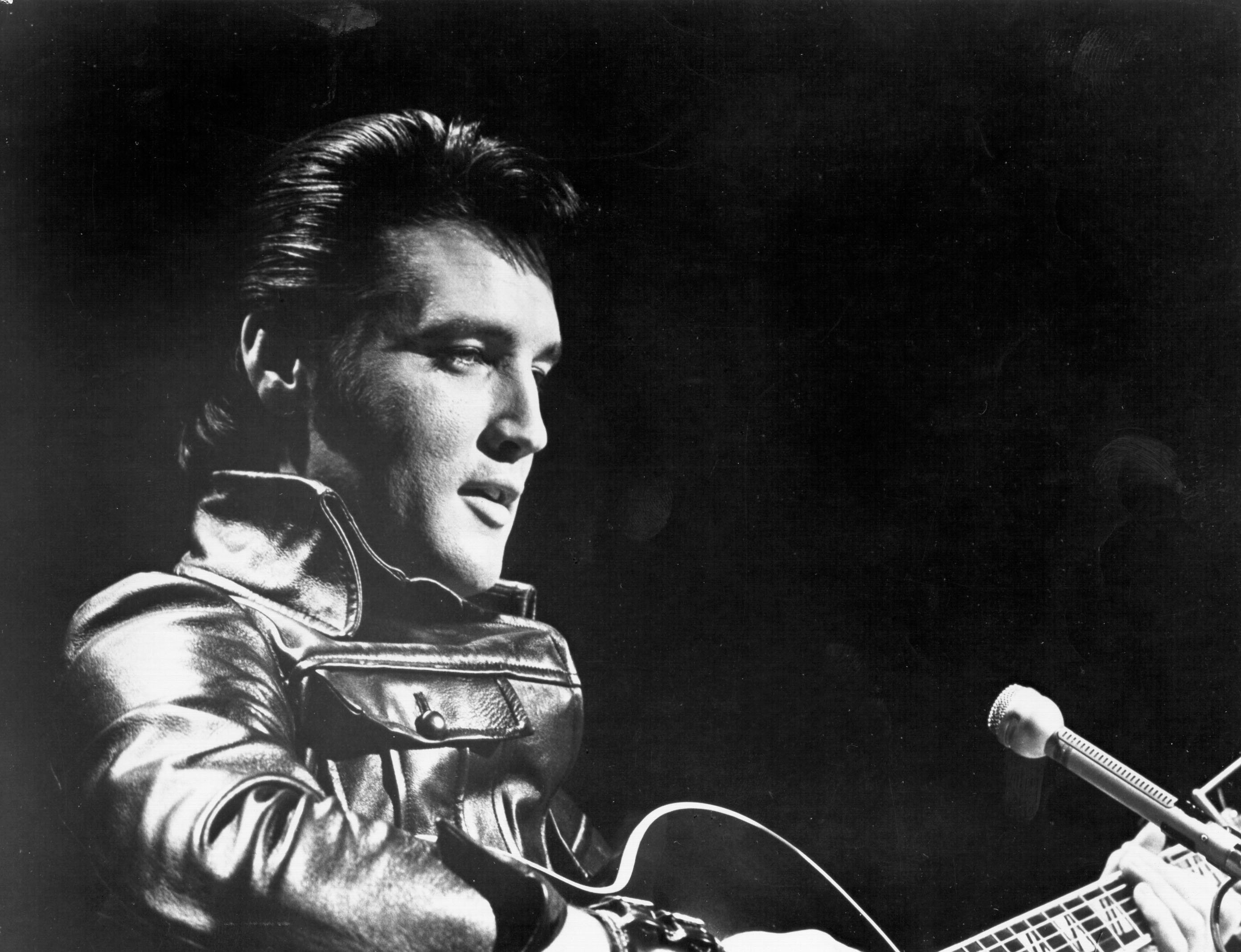 Elvis Presley wearing a leather jacket