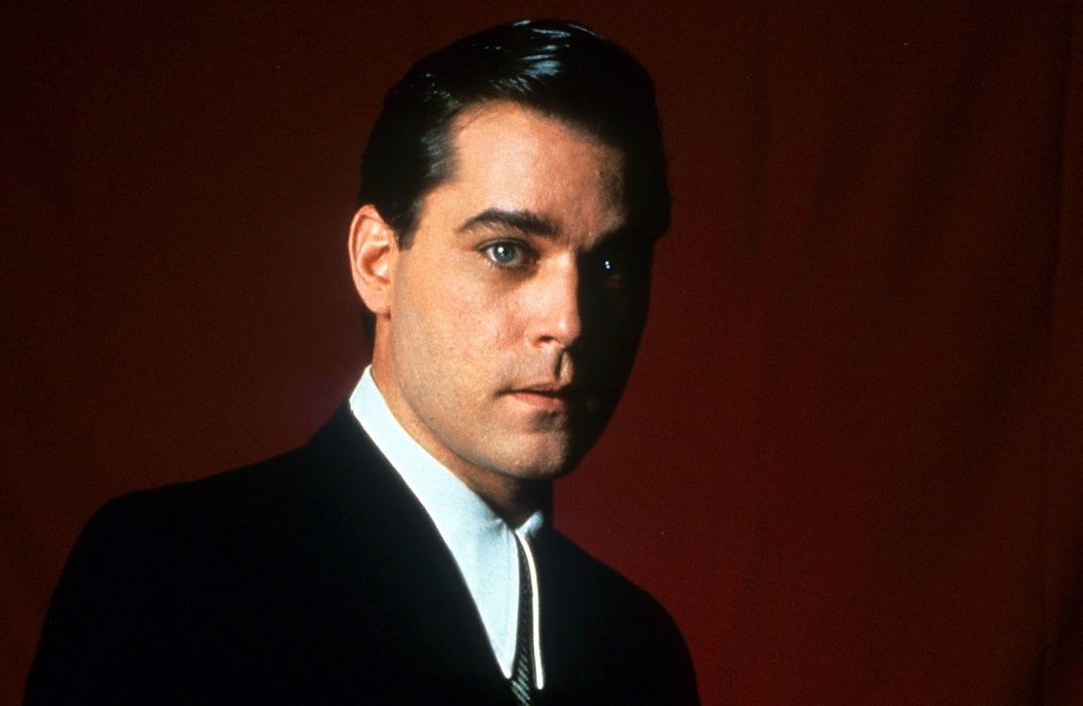 Ray Liotta poses in a black suit as 'Goodfellas' character Henry Hill