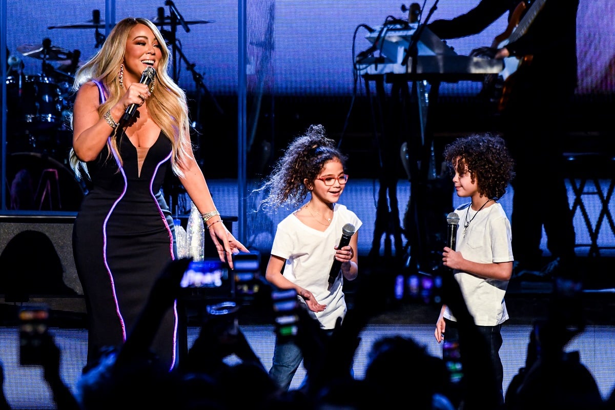 Mariah Carey (L) performs onstage with Monroe Cannon (C) and Moroccan Cannon (R) on March 05, 2019, in Atlanta, Georgia.