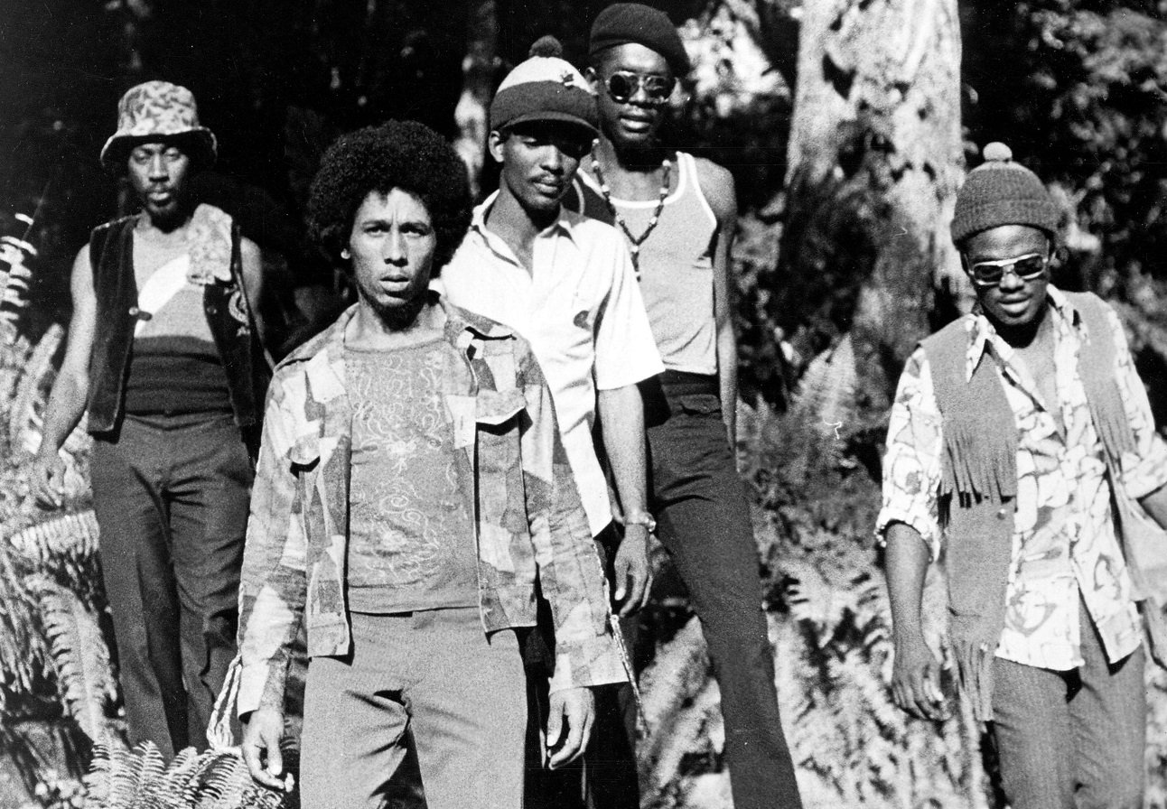 Bob Marley poses for a band photo with The Wailers behind him