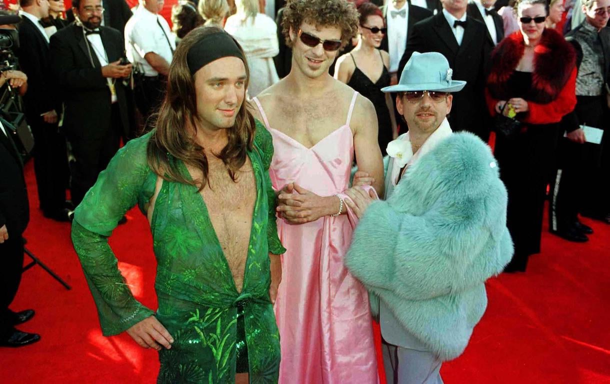 Marc Shalman, [R] with South Park creators, Matt Stone [centre] wearing a dress in the stye of Gwyneth Paltrow's outfit from last year's Oscars and Trey Parker, wearing a dress similar to those worn by Jennifer Lopez