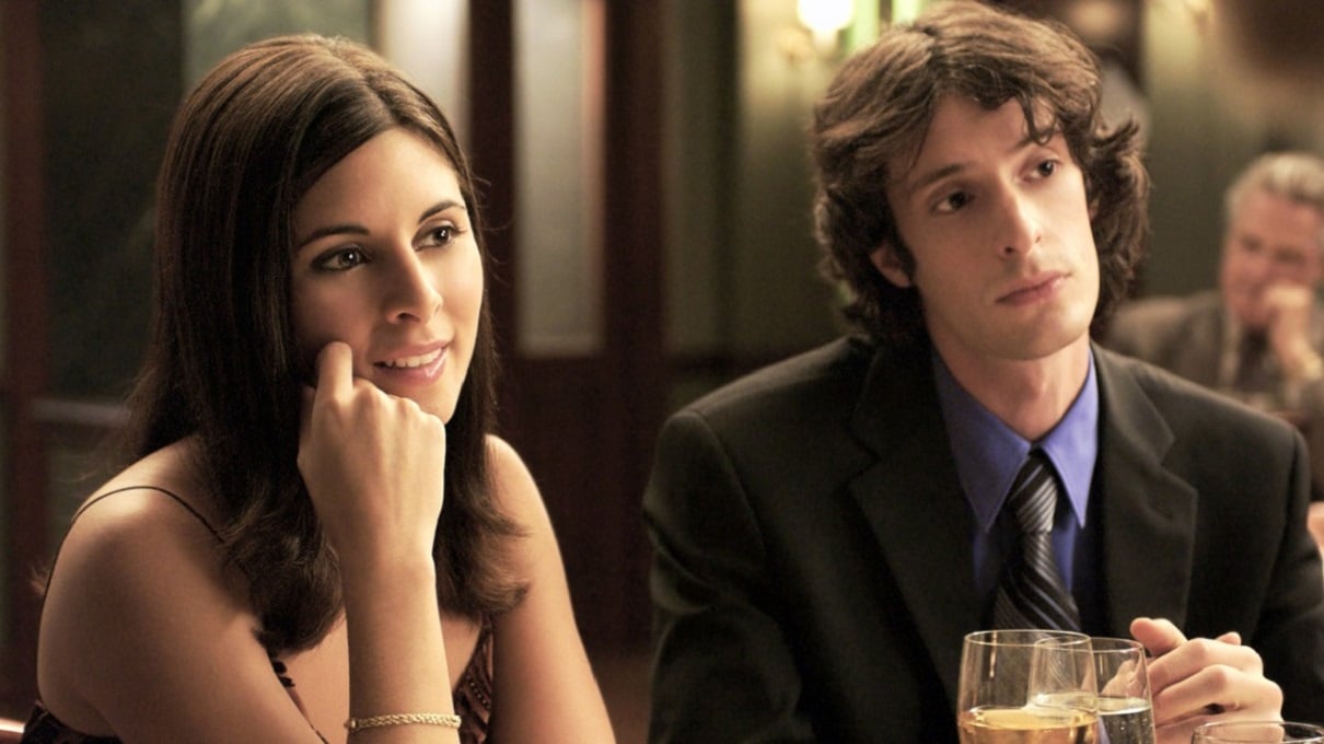 Jamie-Lynn Sigler as Meadow Sopranos and Will Janowitz as Finn DeTrolio look off camera in a 'Sopranos' scene