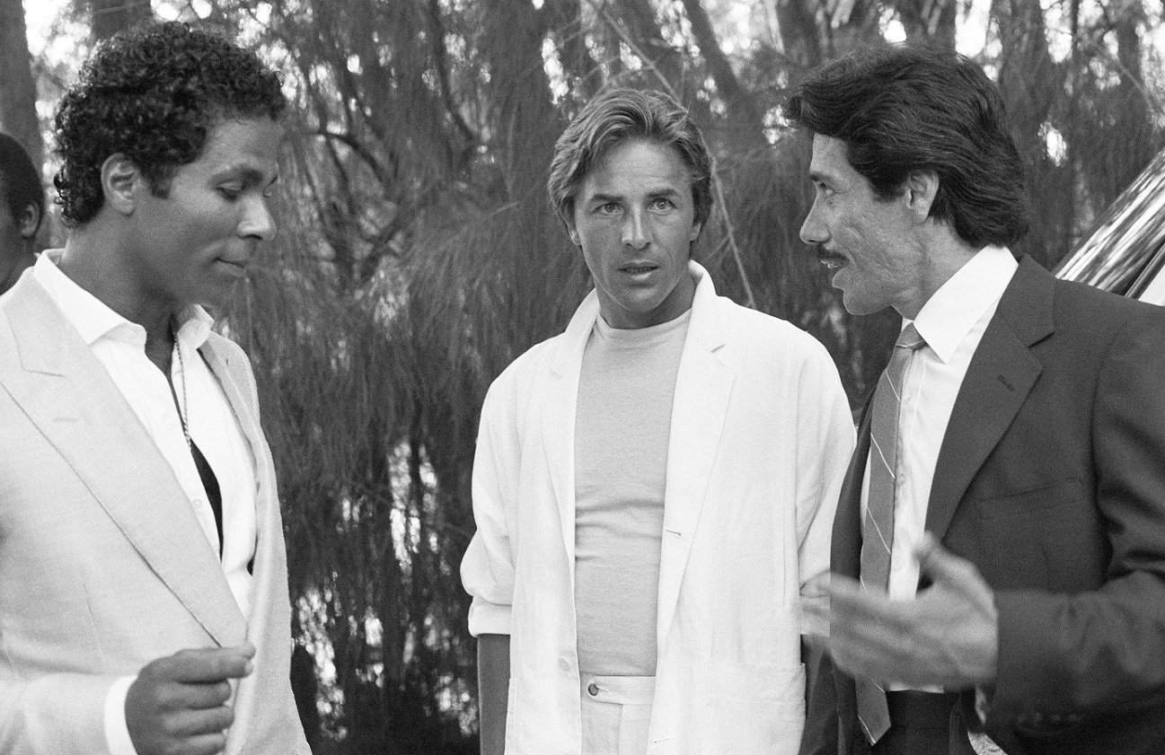 Edward James Olmos speaks to Philip Michael Thomas and Don Johnson on the 'Miami Vice' set.