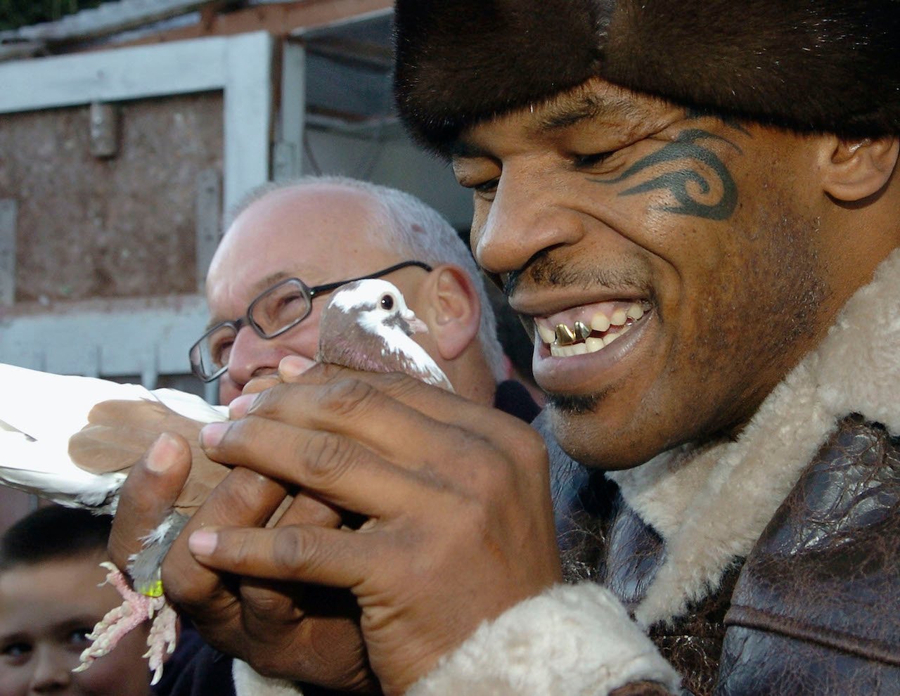 Former world heavyweight boxing champion Mike Tyson meets up with a pigeon fancier Horace Potts (L)