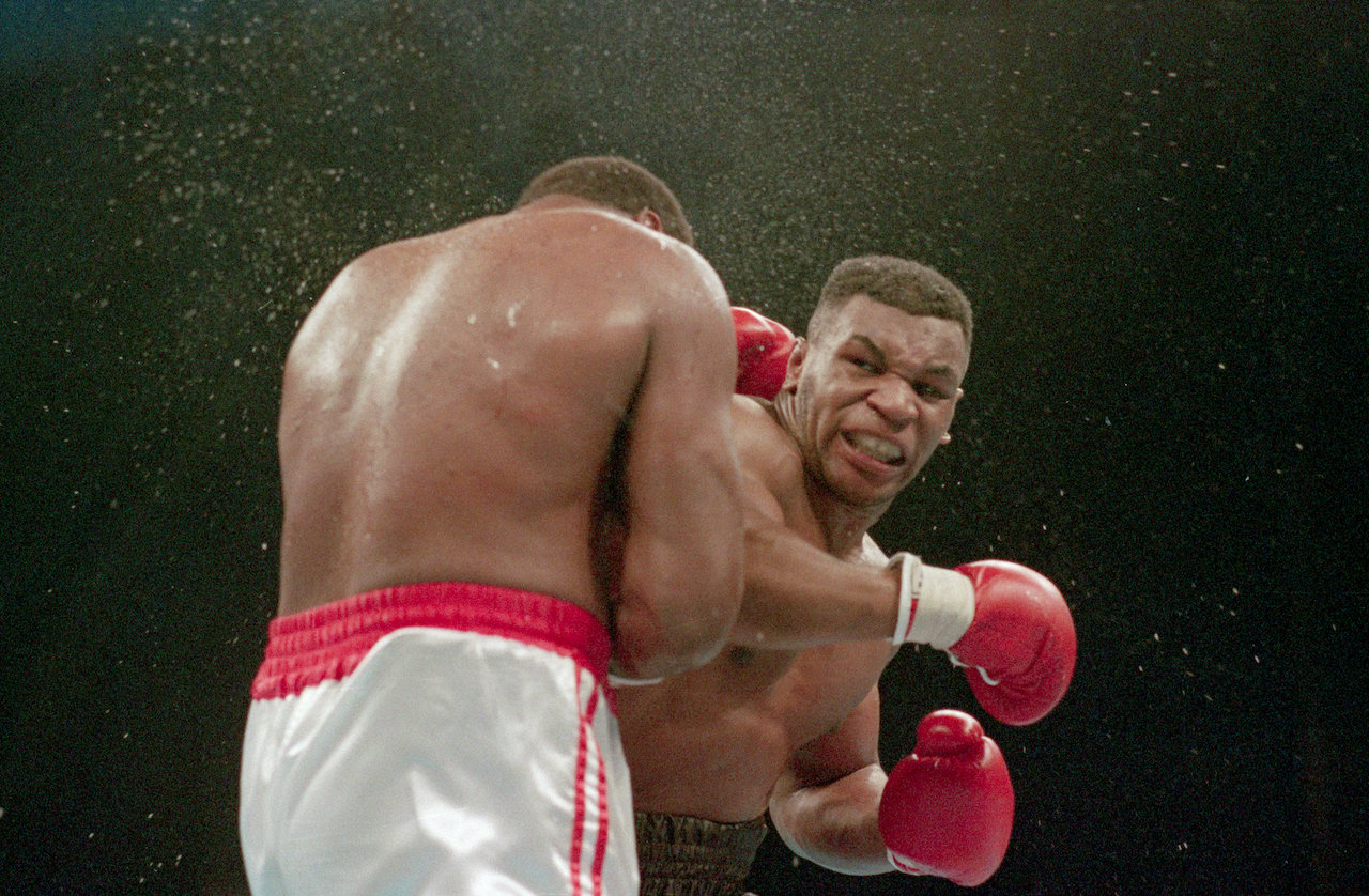 Mike Tyson lands the knockout punch to the jaw of challenger Larry Holmes