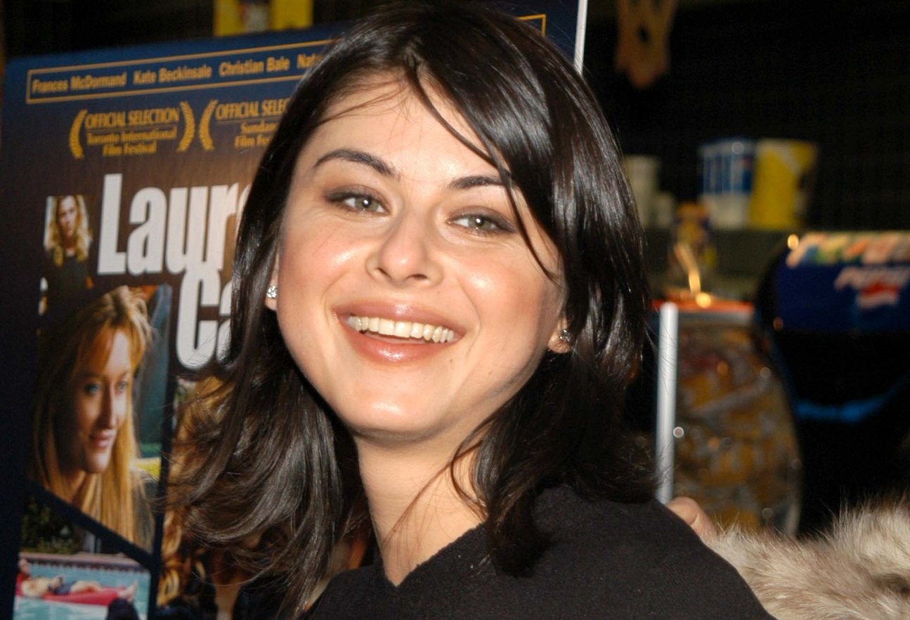 Oksana Lada smiling at a film premiere in the early 2000s