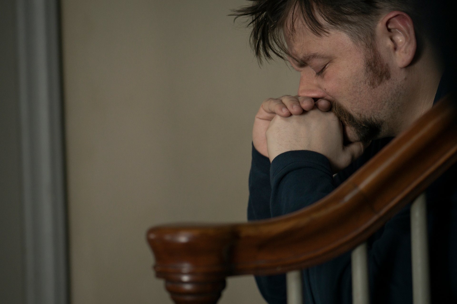 Patrick Murney in profile with eyes closed in Mare of Easttown