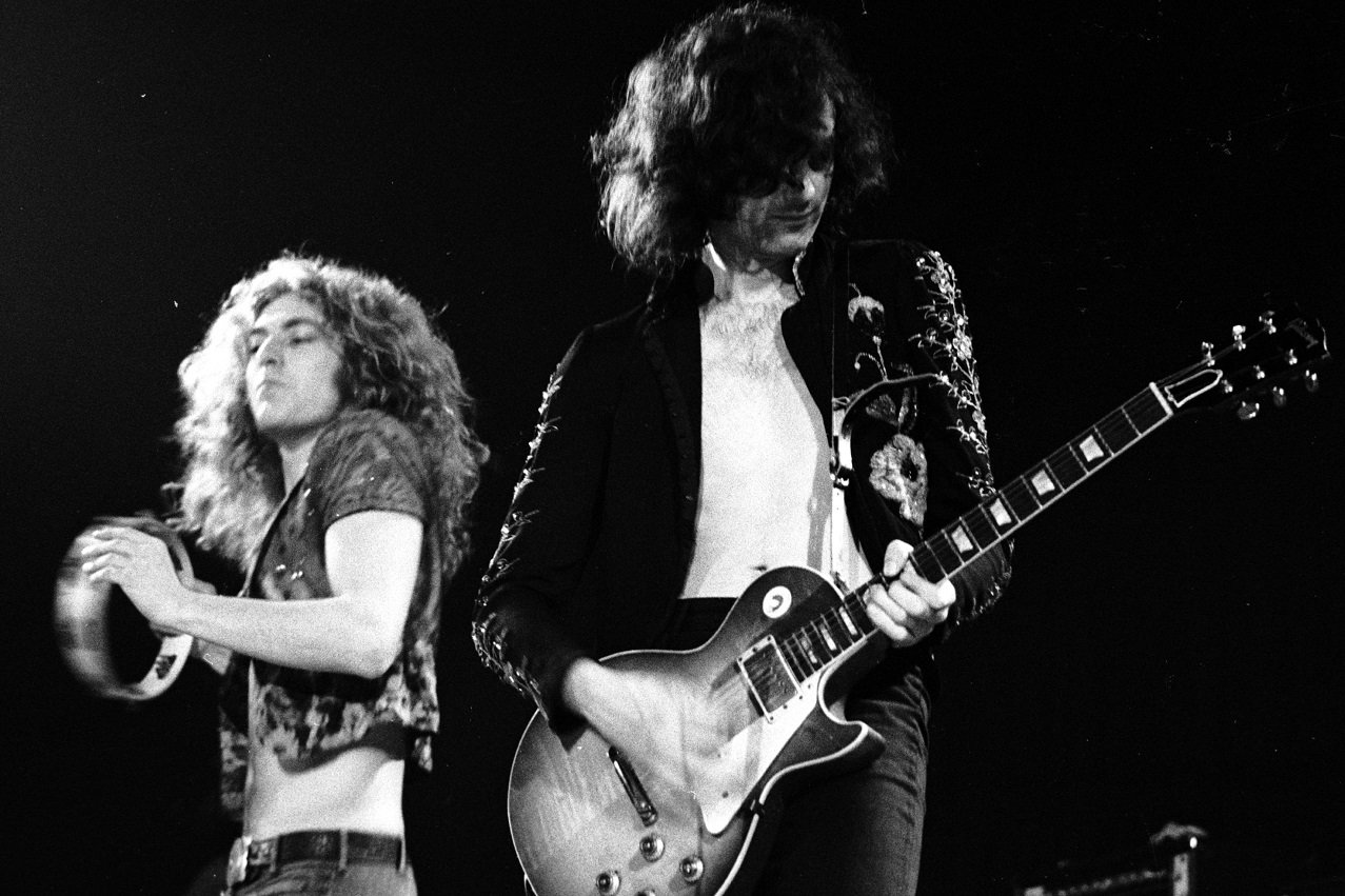 Robert Plant plays tambourine as Jimmy Page plats guitar at a 1973 concert