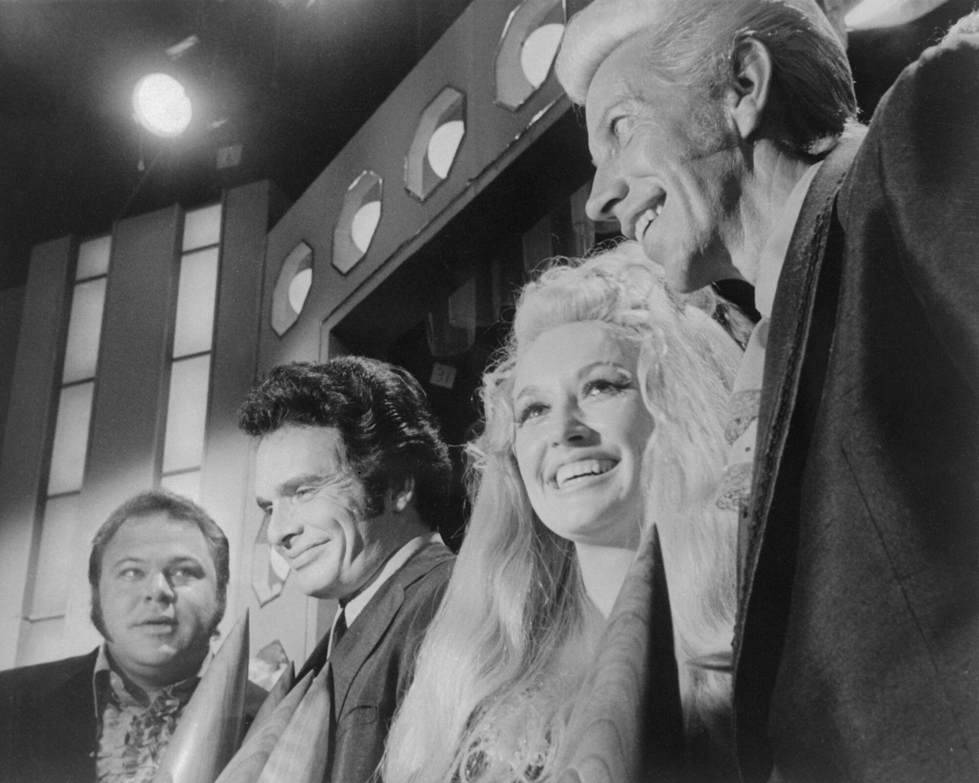 Roy Clark, Merle Haggard, Dolly Parton, and Porter Wagoner are shown here at the Country Music Association annual awards show.