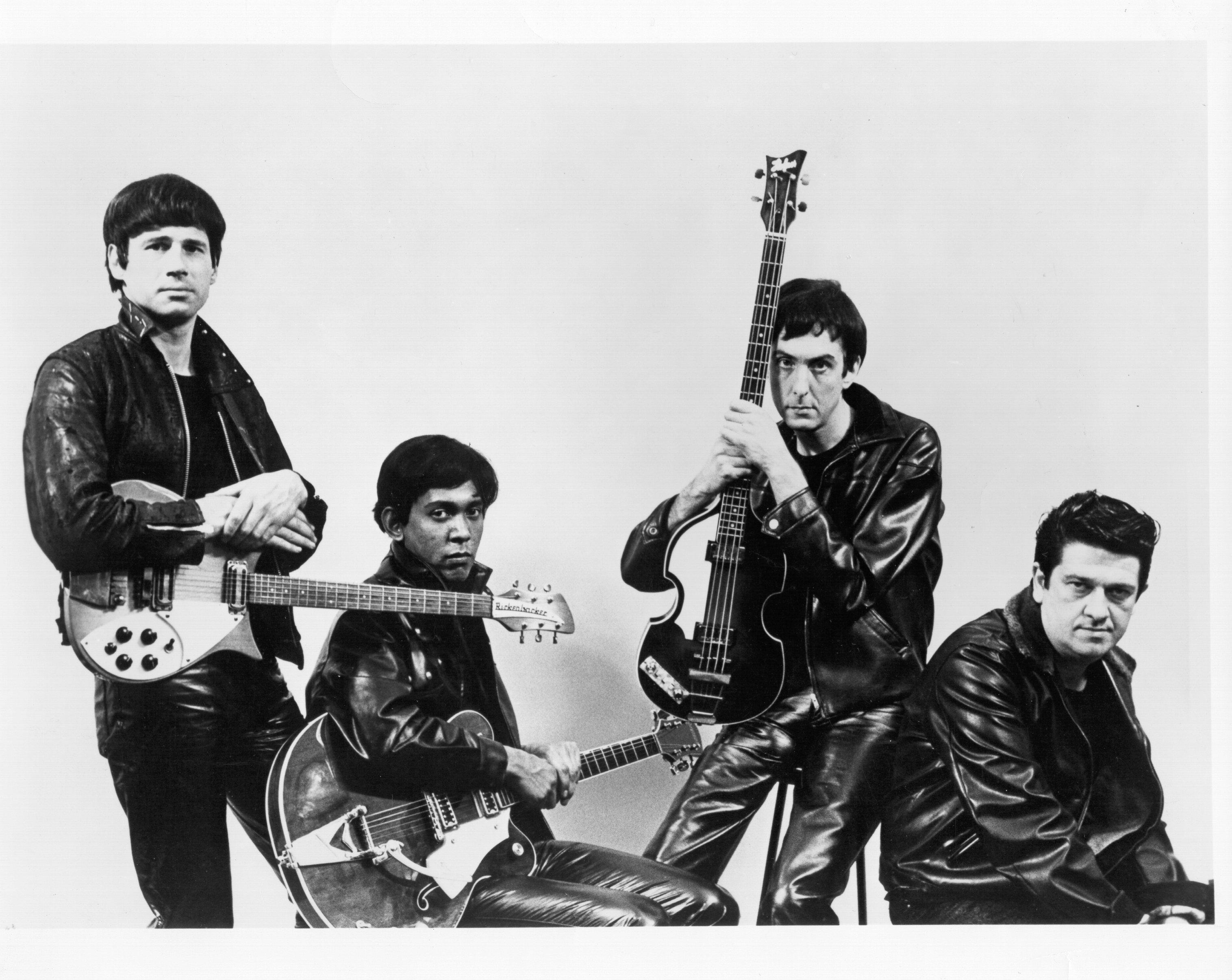 The Rutles dressed like The Beatles during their leather jacket period