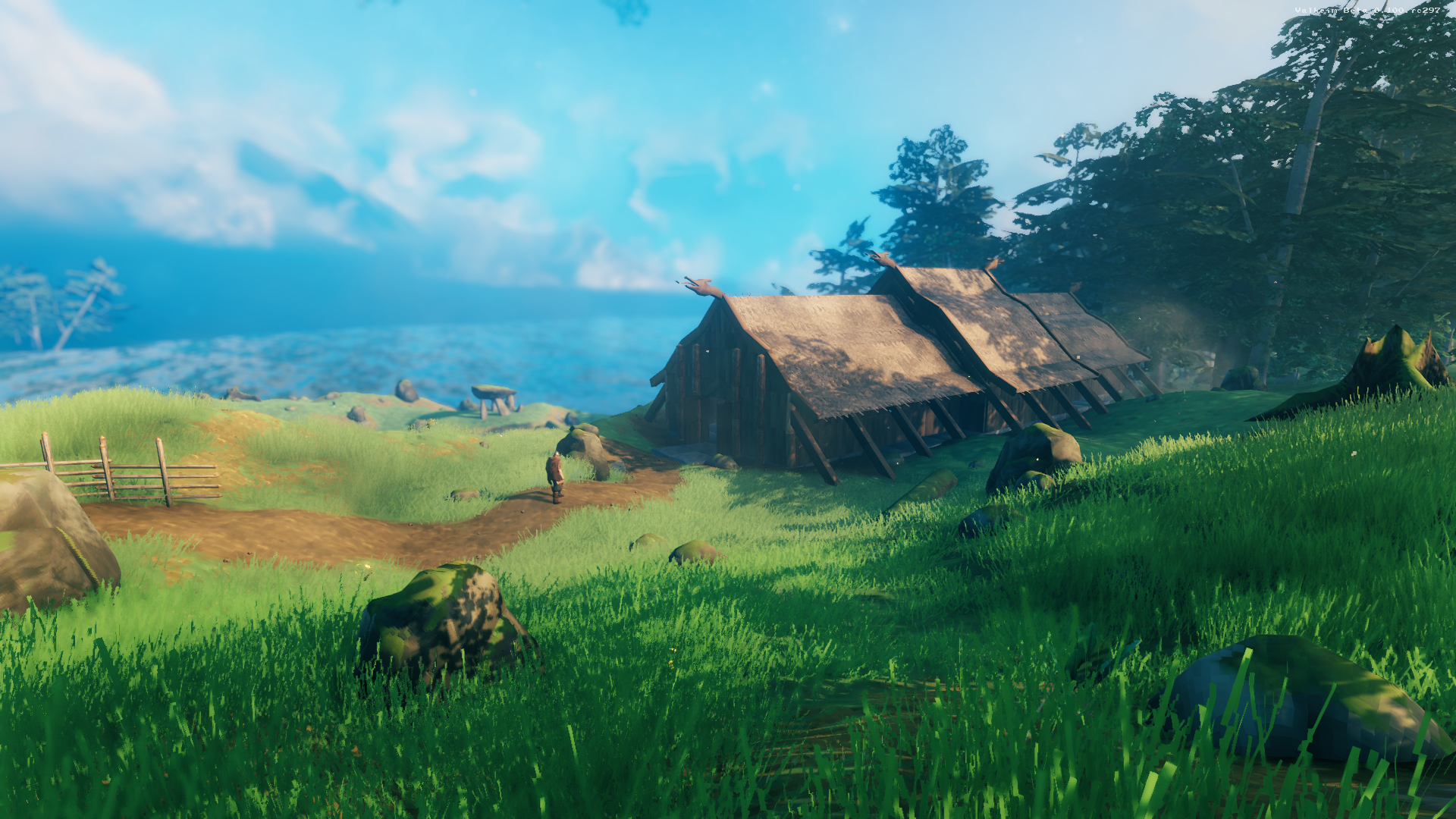 A viking stands in a meadow in Iron Gate's Valheim, produced by Coffee Stain Studios