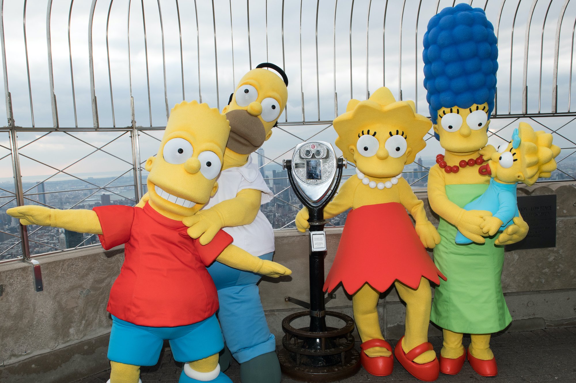 Bart Simpson, Homer Simpson, Lisa Simpson, Marge Simpson and Maggie Simpson visit The Empire State Building