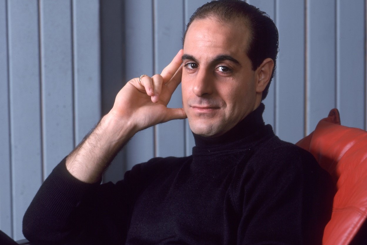 Portrait of Stanley Tucci seated in 1988