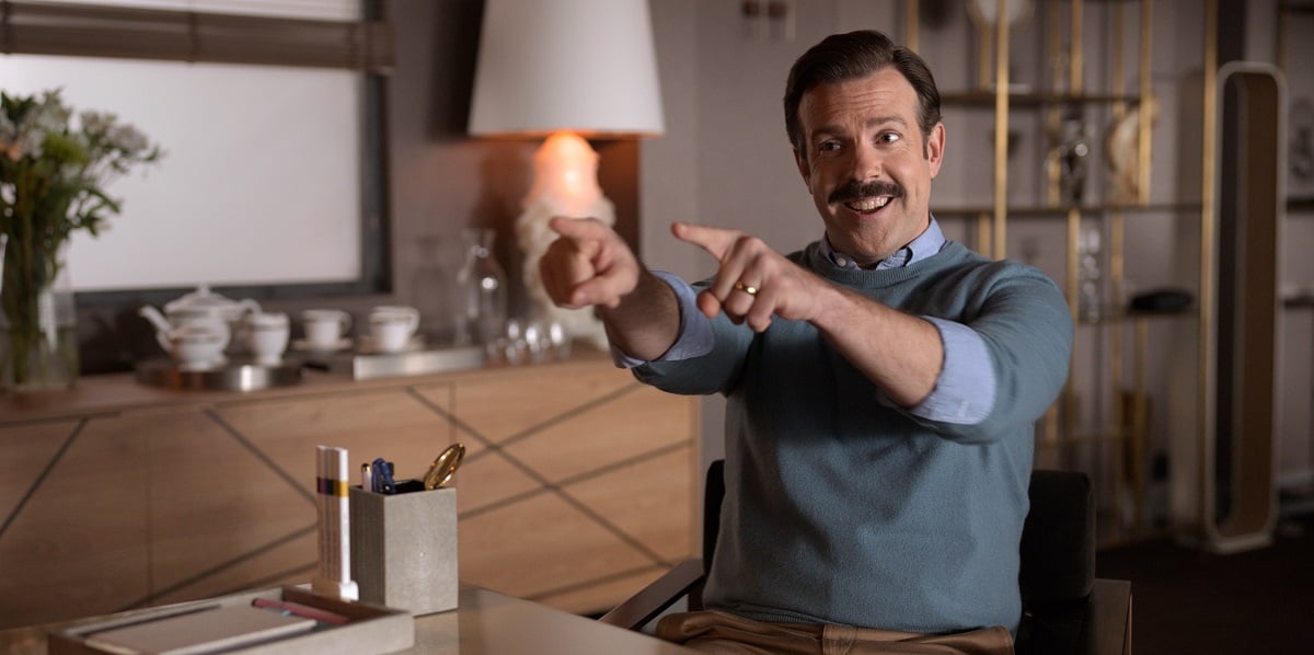 Jason Sudeikis smiling and pointing in 'Ted Lasso'