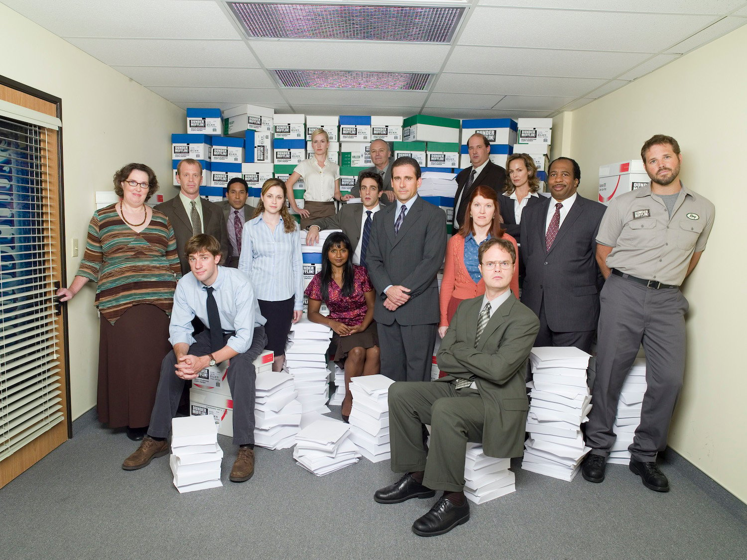 'The Office' John Krasinski with cast mates posing in character.