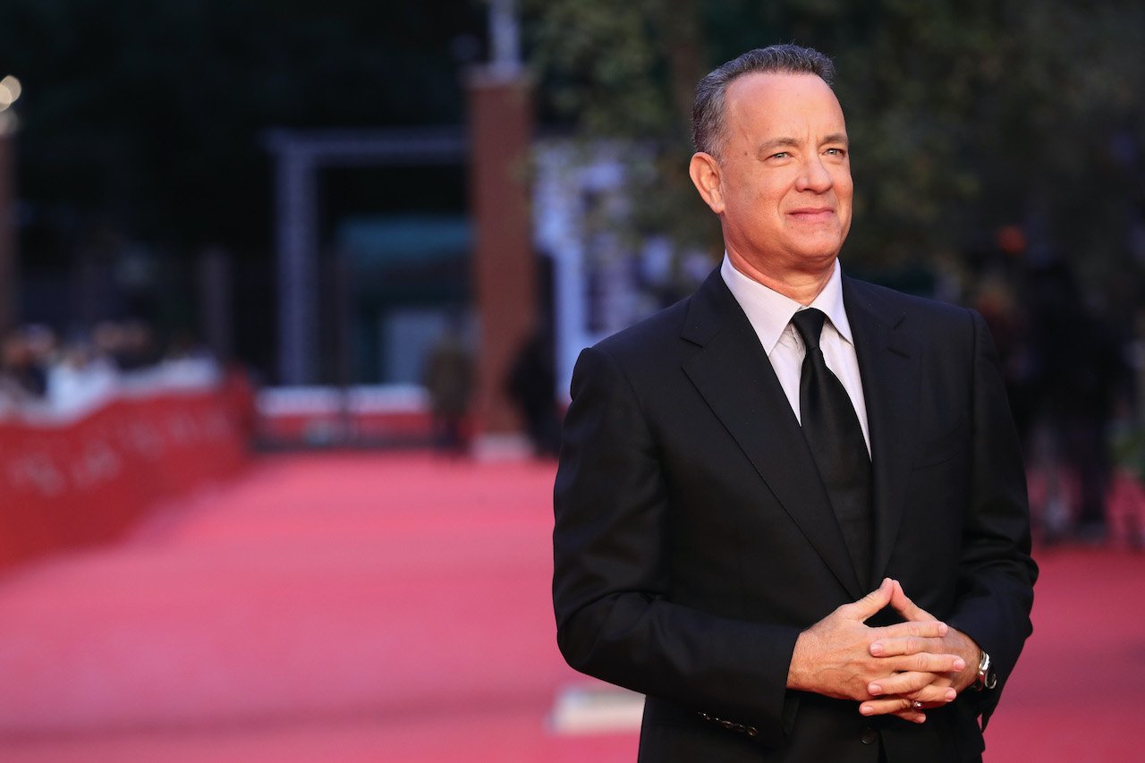 Tom Hanks walks a red carpet