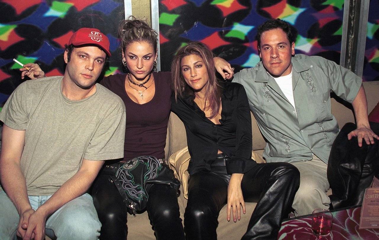 Vince Vaughn, Drea De Matteo, Jennifer Esposito, and Jon Favreau seated together at a club, circa 2000