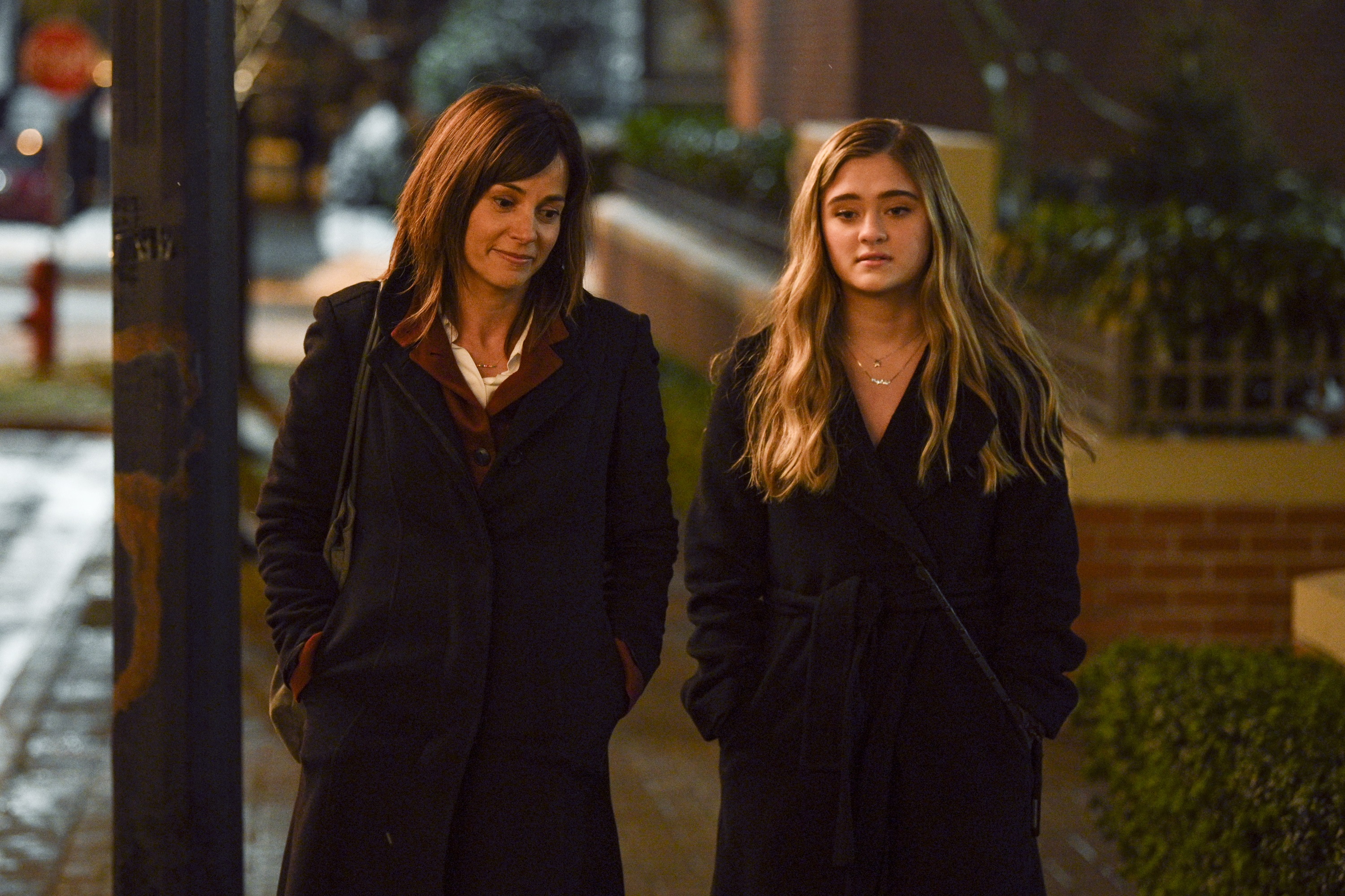 A Million Little Things season 4 cast members Stephanie Szostak as Delilah Dixon and Lizzy Greene as Sophie Dixon walking together