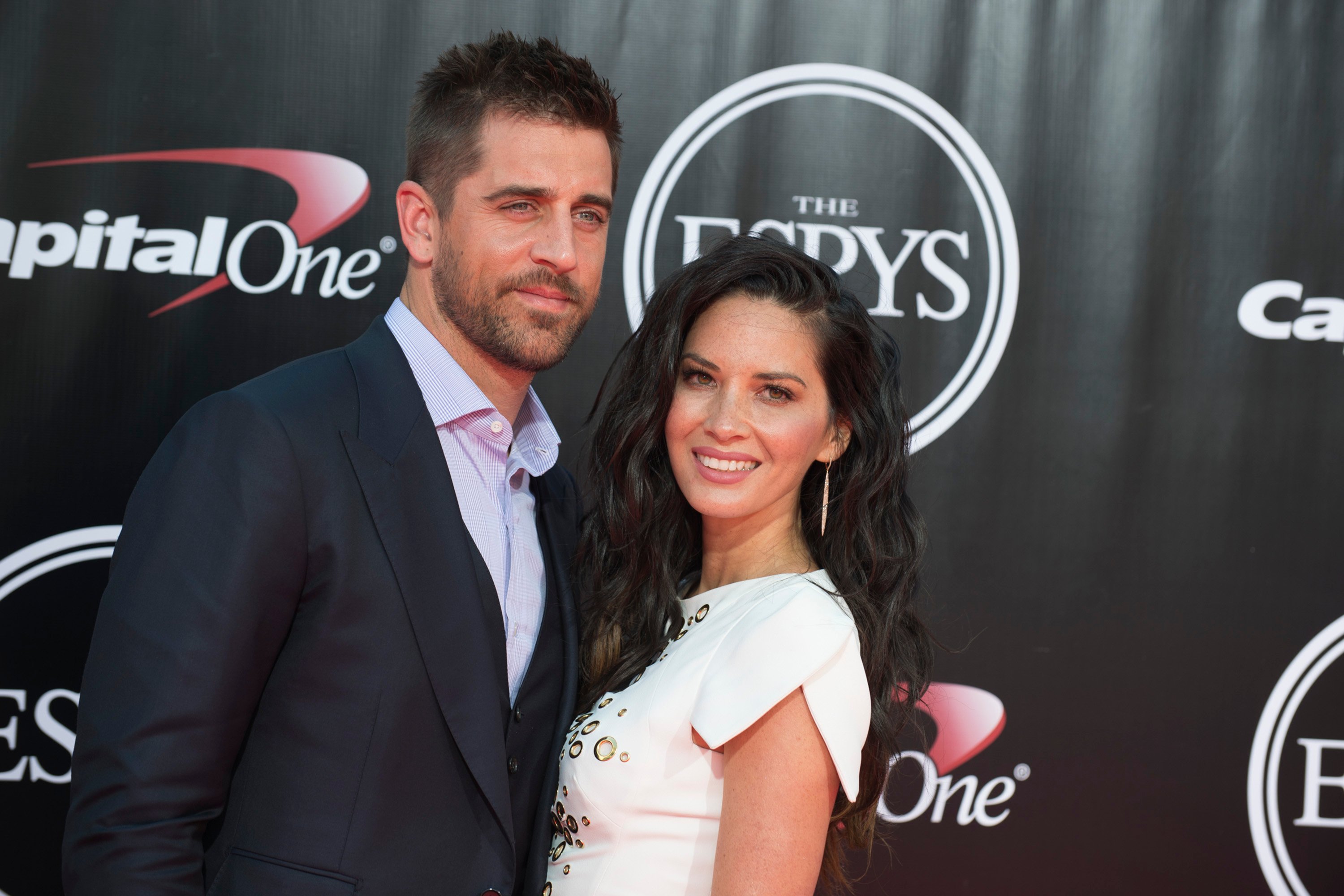 Aaron Rodgers and Olivia Munn posing together on the red carpet at the 2016 ESPYS
